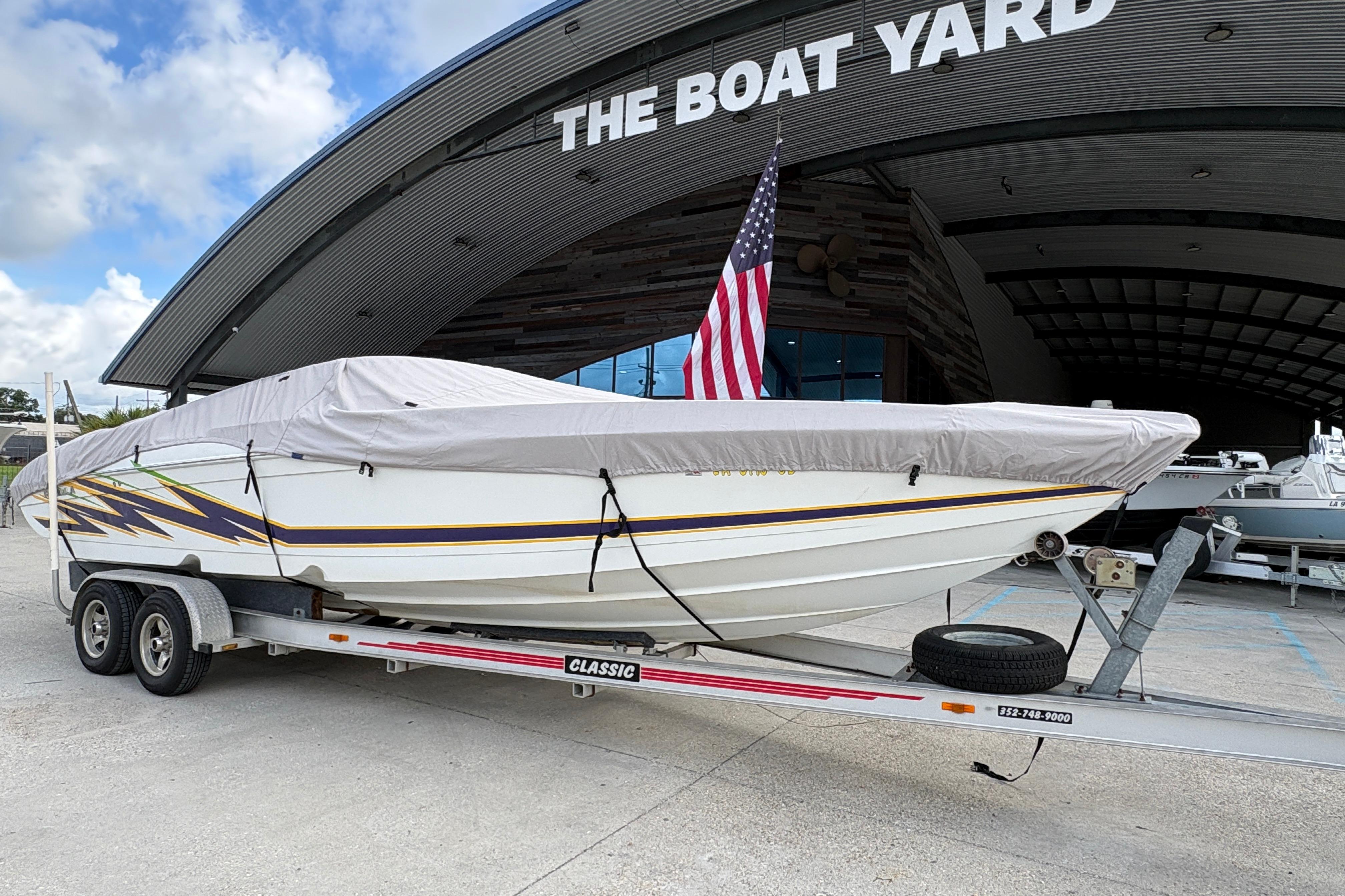 2002 Formula 292 FASTech boat on trailer at The Boat Yard, covered and ready for transport.