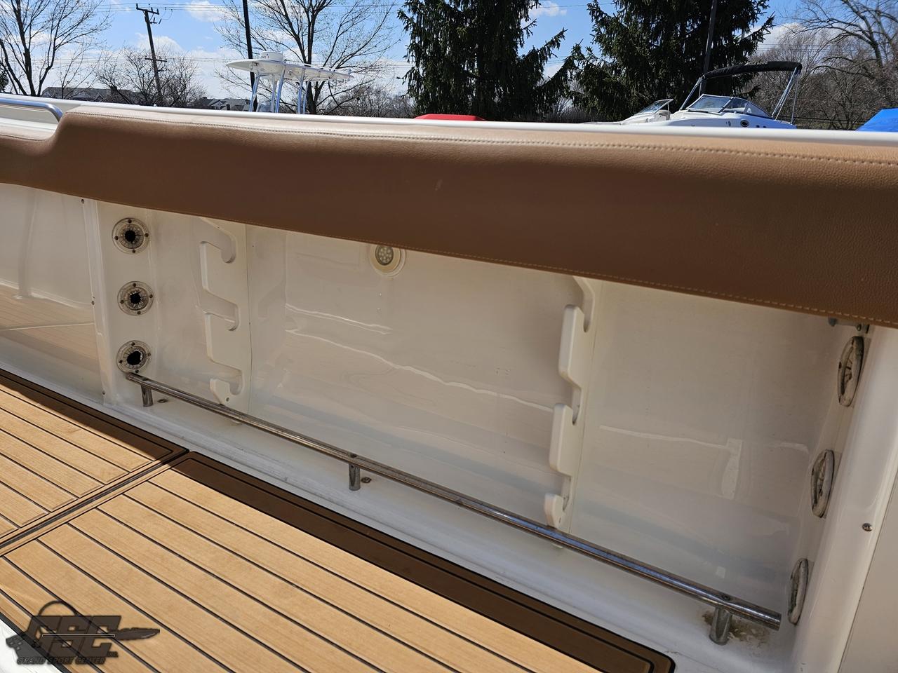 2007 Triton 351 CC boat interior with tan upholstery and wooden deck.