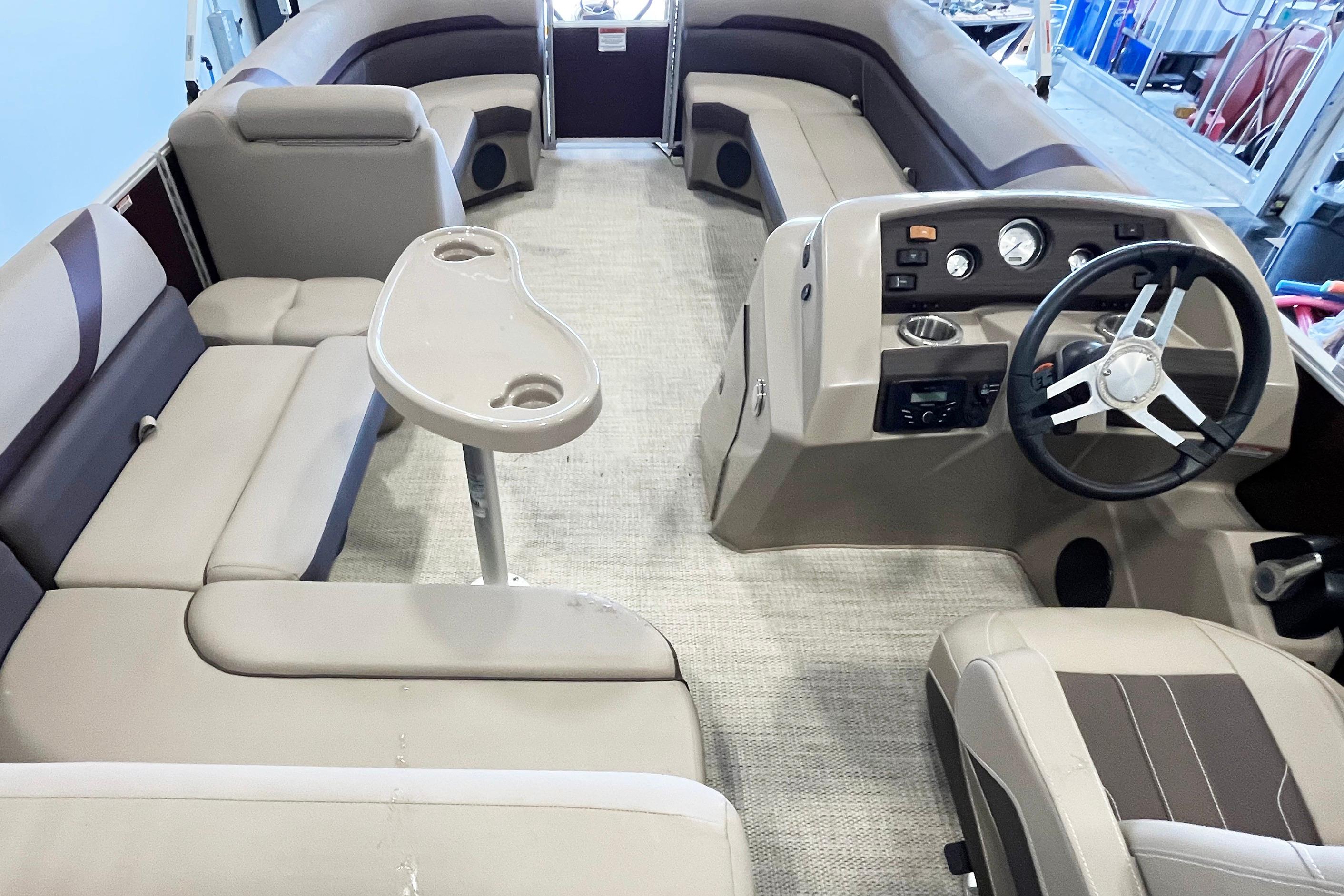 2020 Bennington SX25 boat interior with plush seating and modern helm controls.