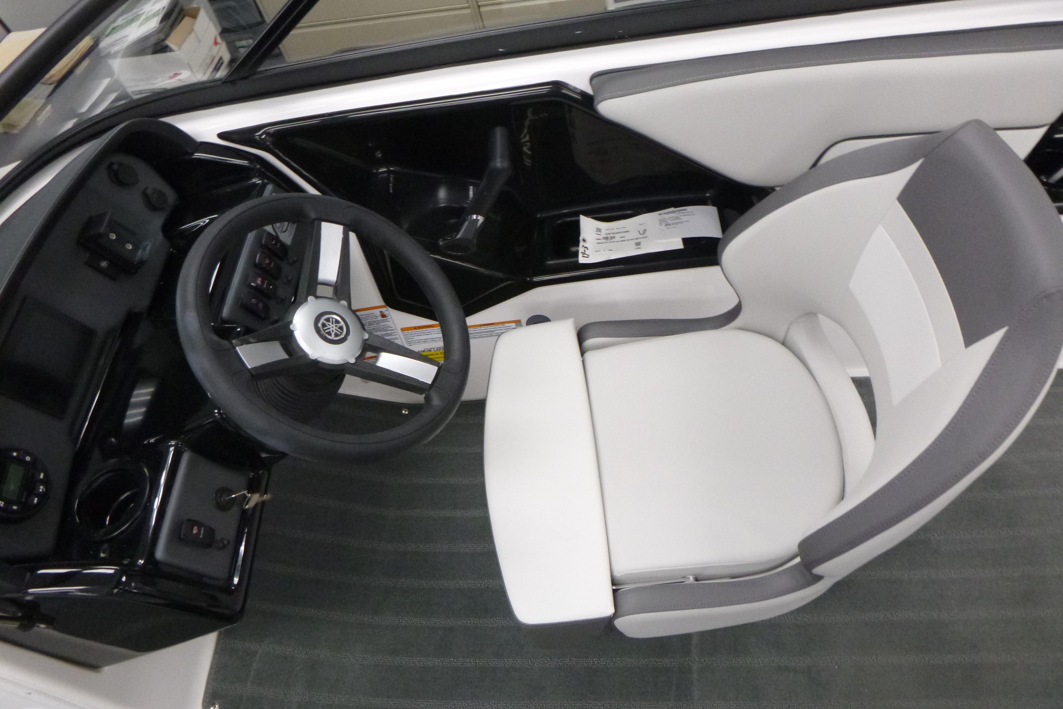 2026 Yamaha AR190 boat cockpit with steering wheel and modern seating.