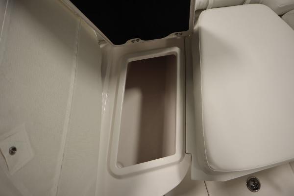 2025 Sea Fox 228 Commander storage compartment with cushioned seating.