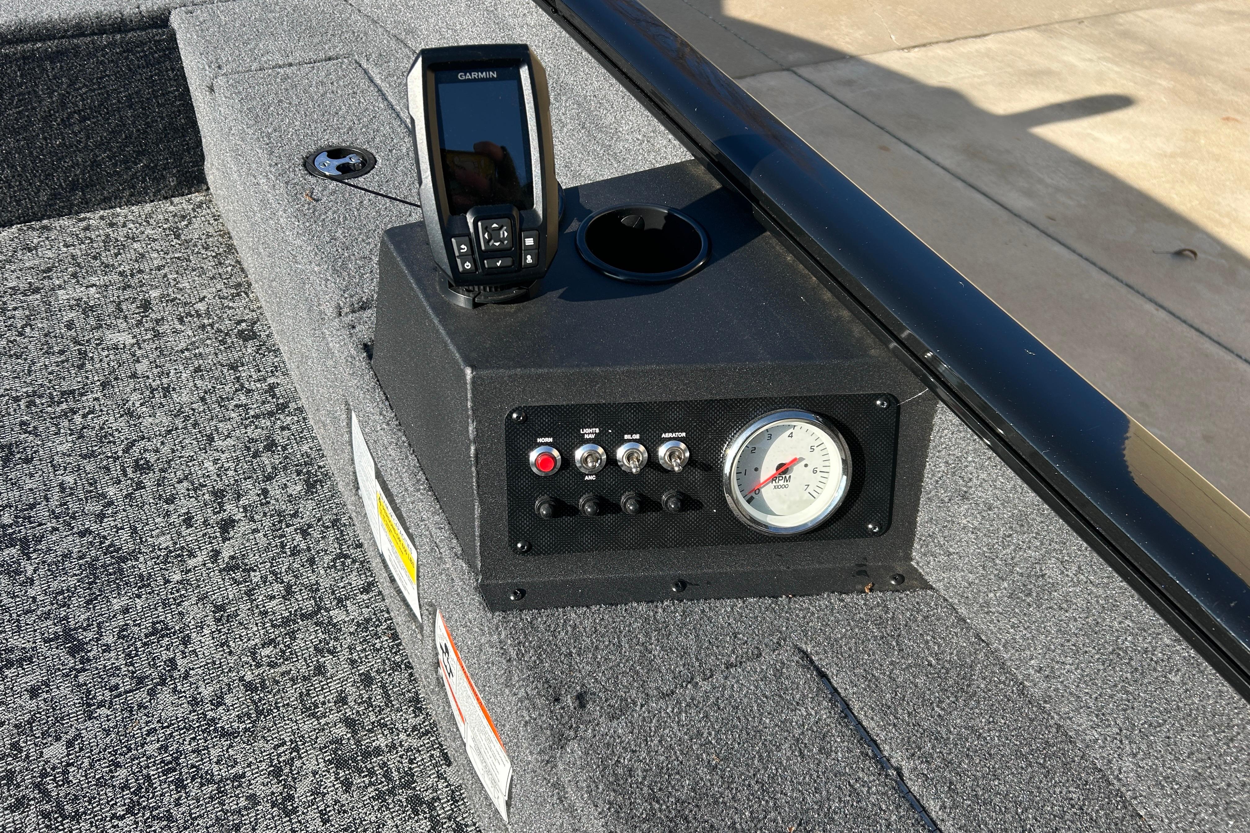 2025 Tracker Super Guide V-16 T boat dashboard with Garmin device and RPM gauge.