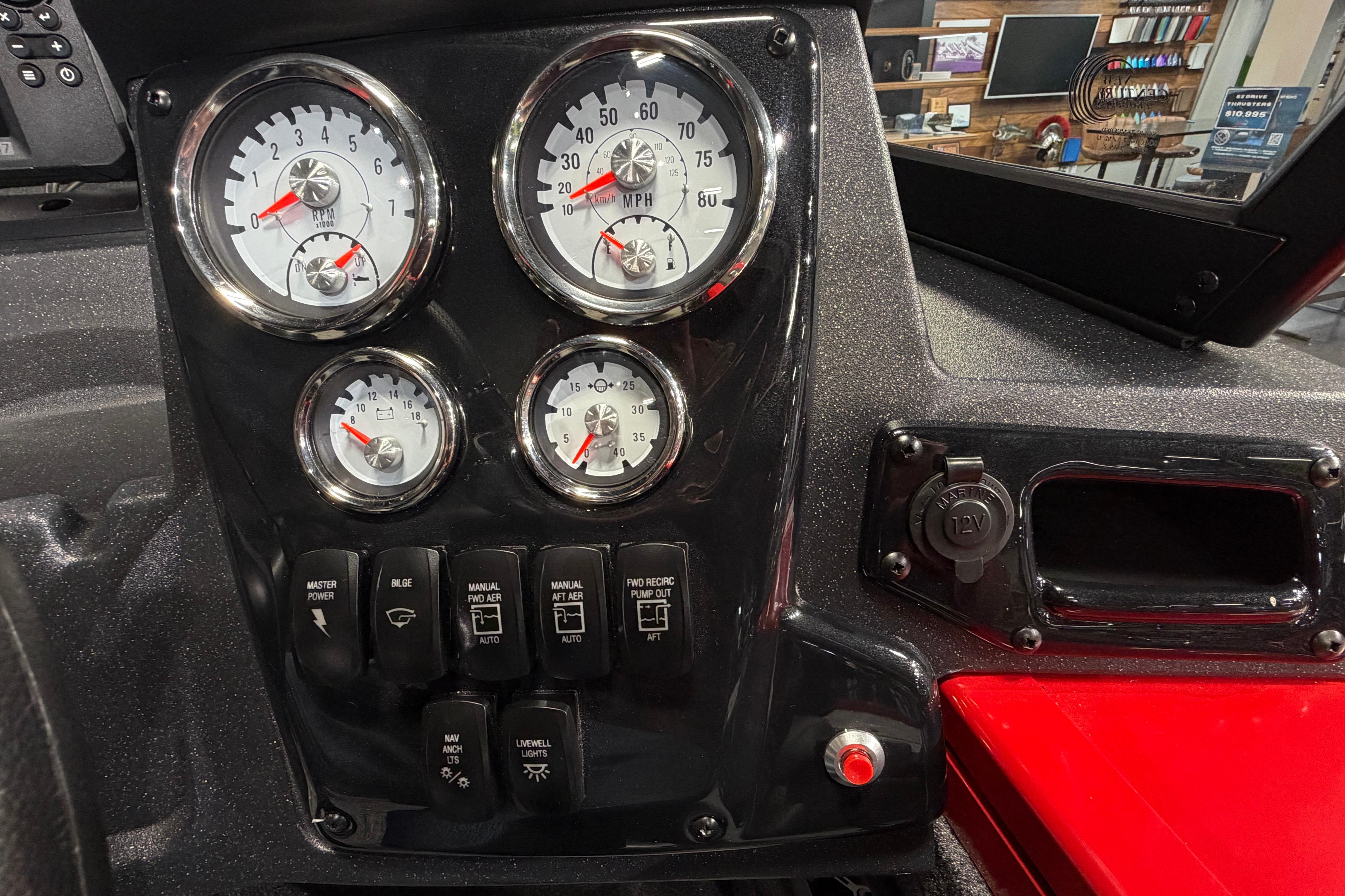 Dashboard of 2026 Tracker Targa V-18 Combo with gauges and control switches.