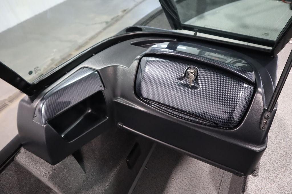 2026 Lowe Fishing Machine 175 dashboard with storage compartment and windshield.