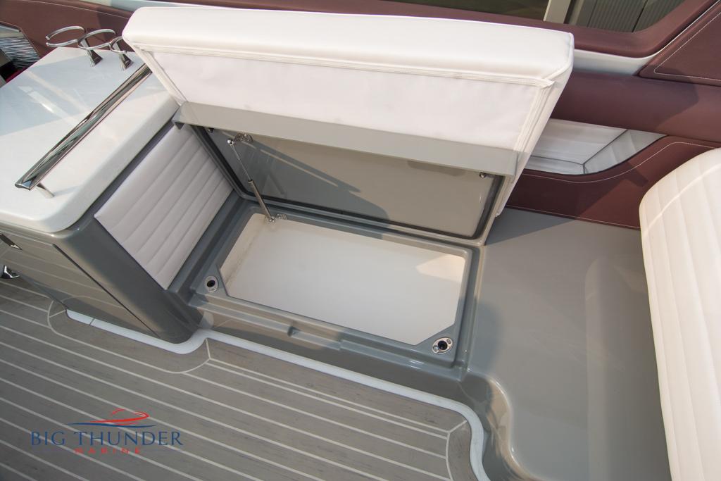2019 Donzi 41 GT boat interior storage compartment with white and gray seating.