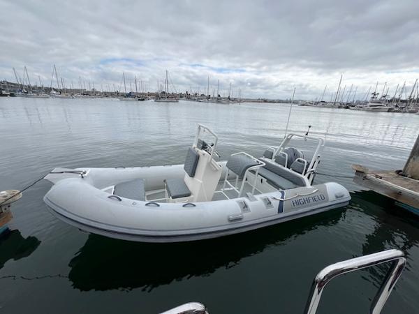 2017 Highfield OM 500 inflatable boat docked in a marina.