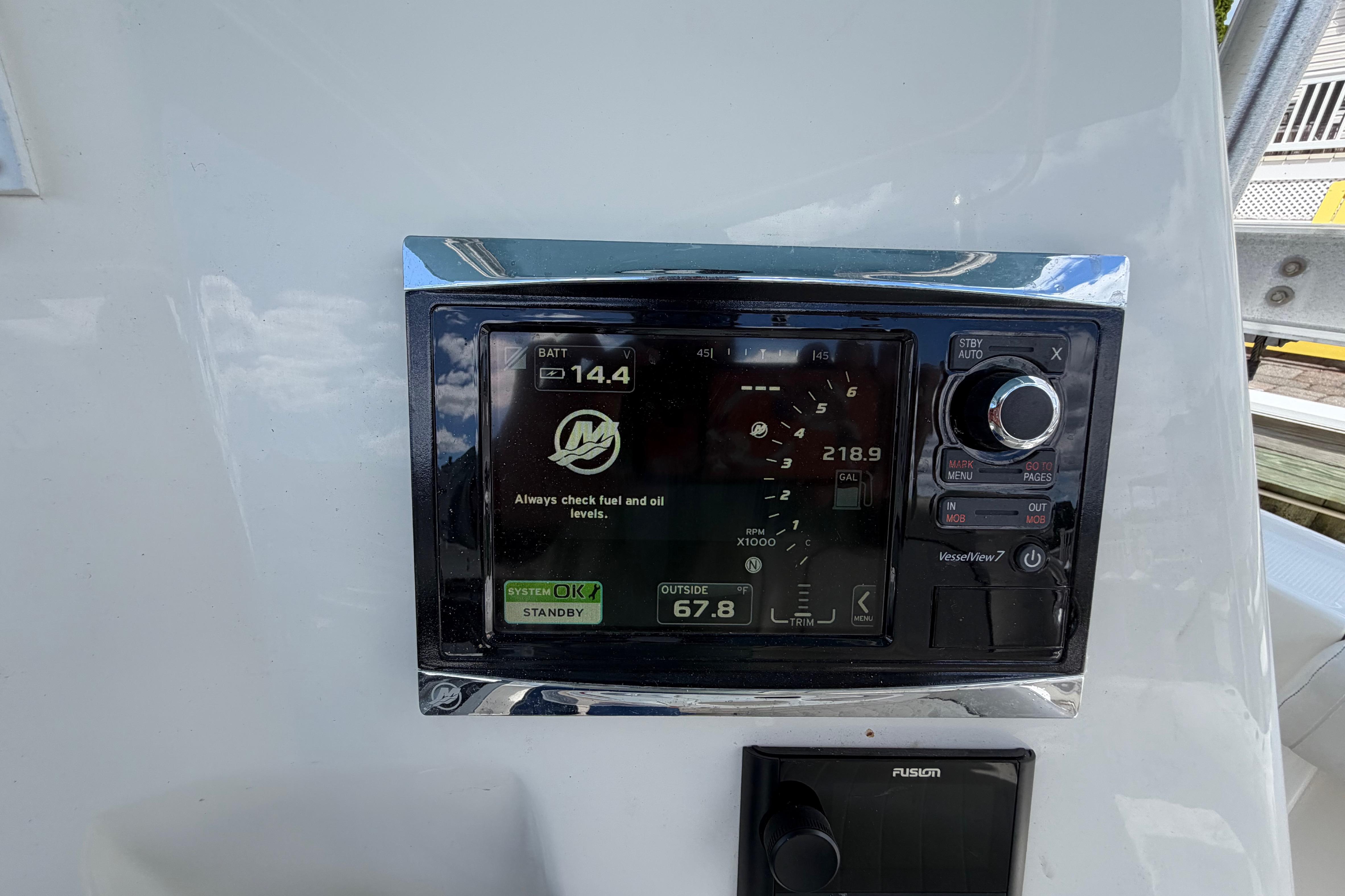 Close-up of a 2017 Mako 284 Center Console boat's control panel display.