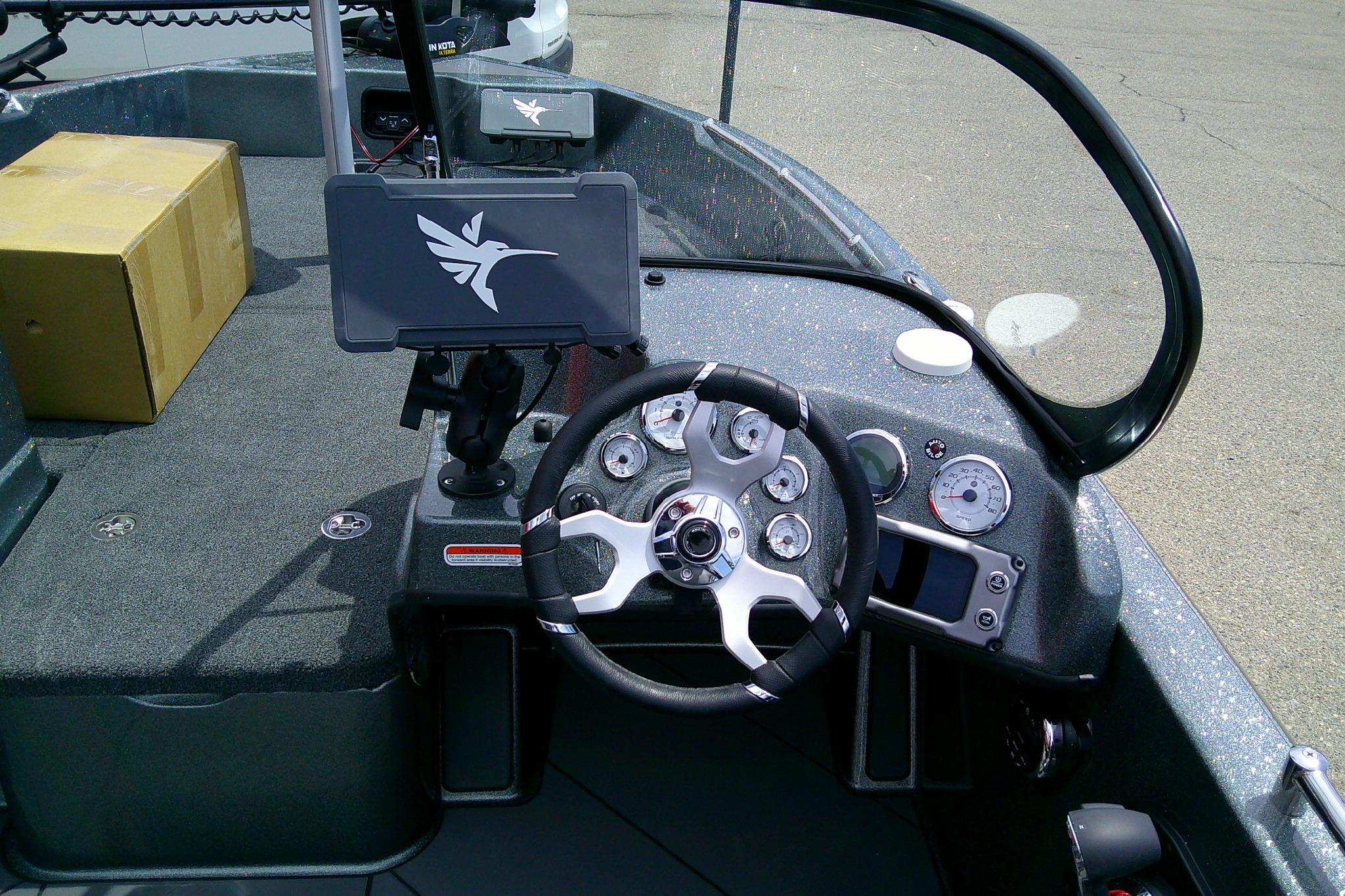Cockpit of 2026 Nitro ZV19 Sport boat with steering wheel and dashboard controls.