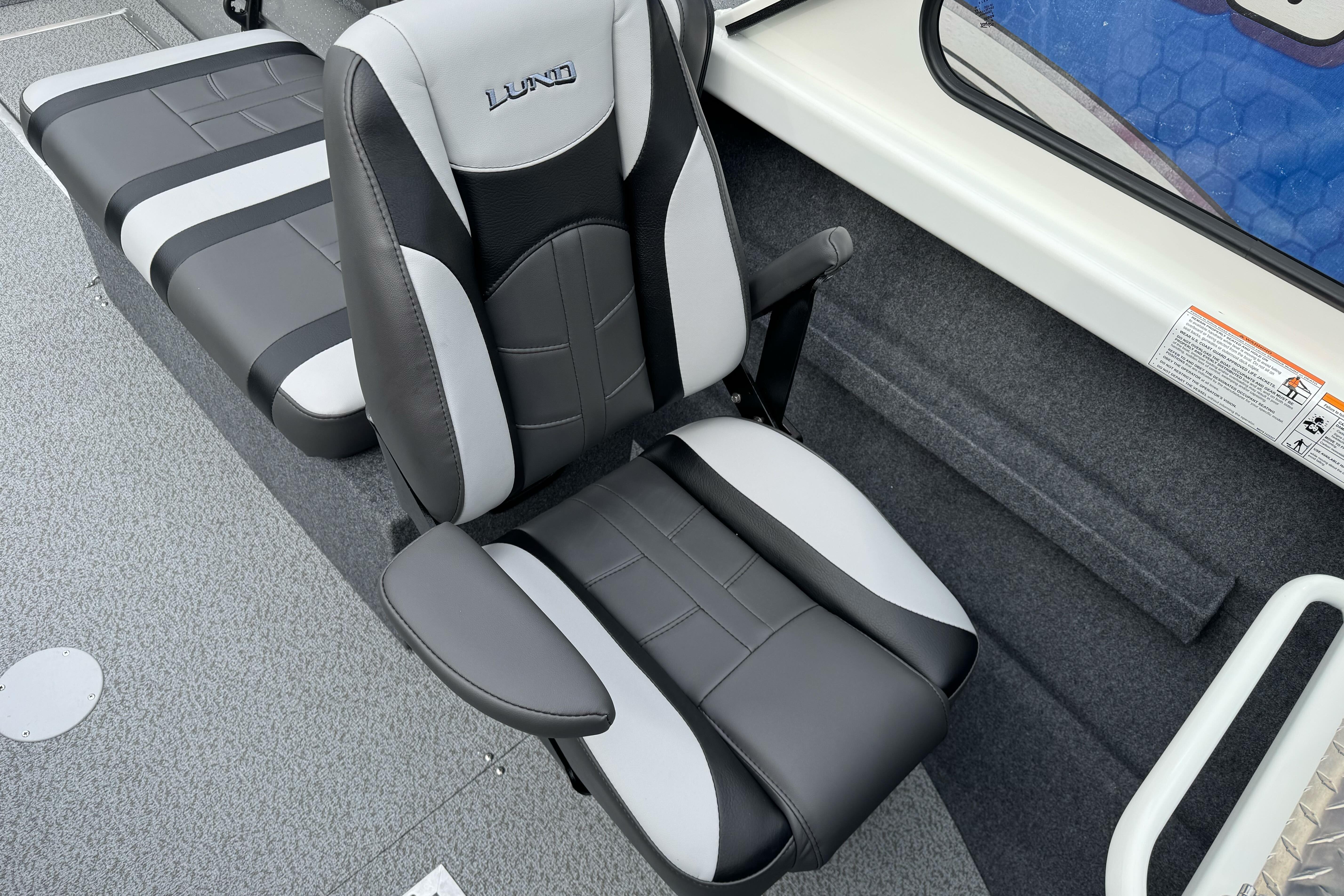 2026 Lund 185 Heavy Gauge boat interior with black and gray seating.