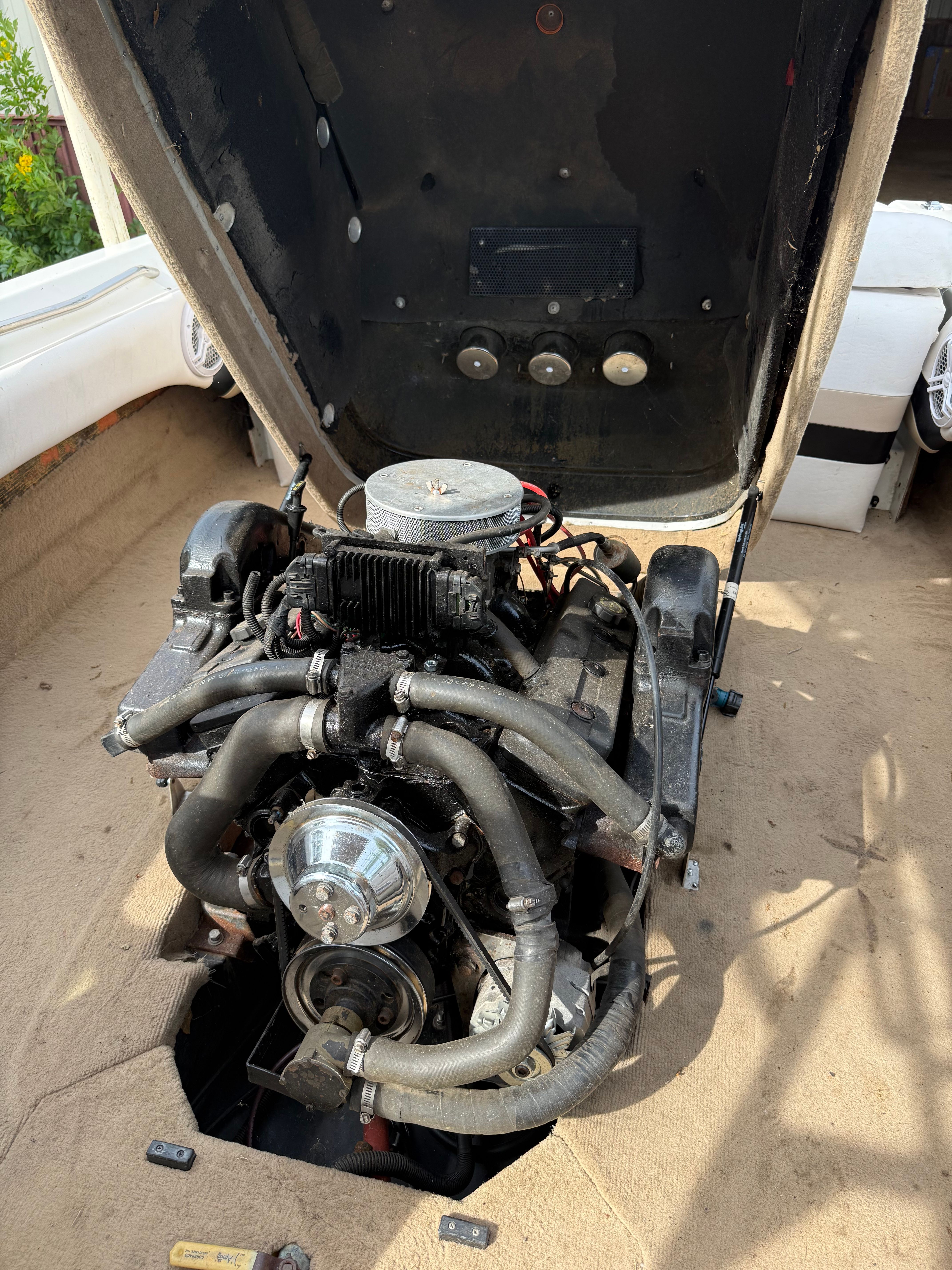Engine of a 1997 MasterCraft ProStar 190 boat, open for maintenance.