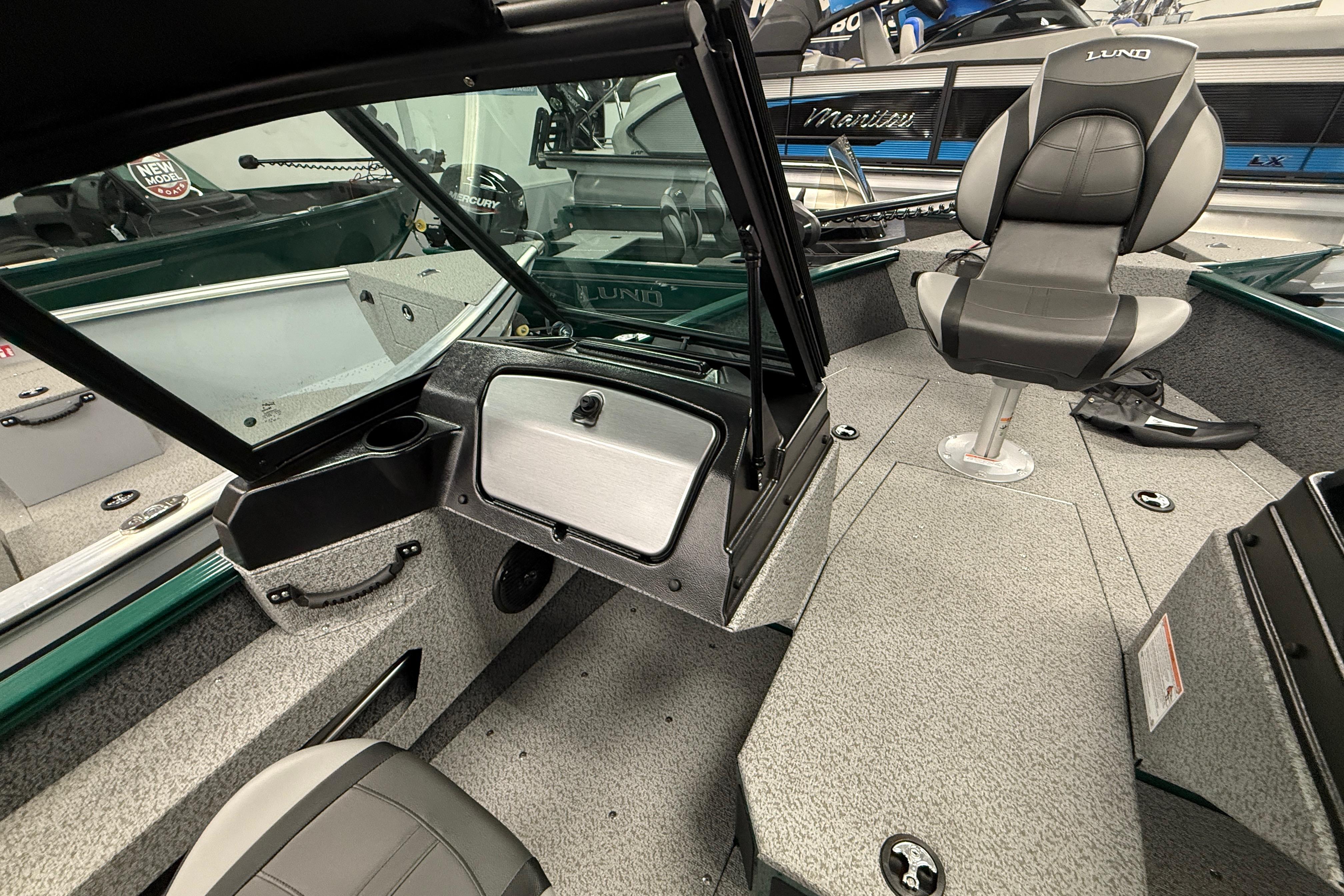 2026 Lund 1775 Adventure Sport boat interior with seating and storage compartments.