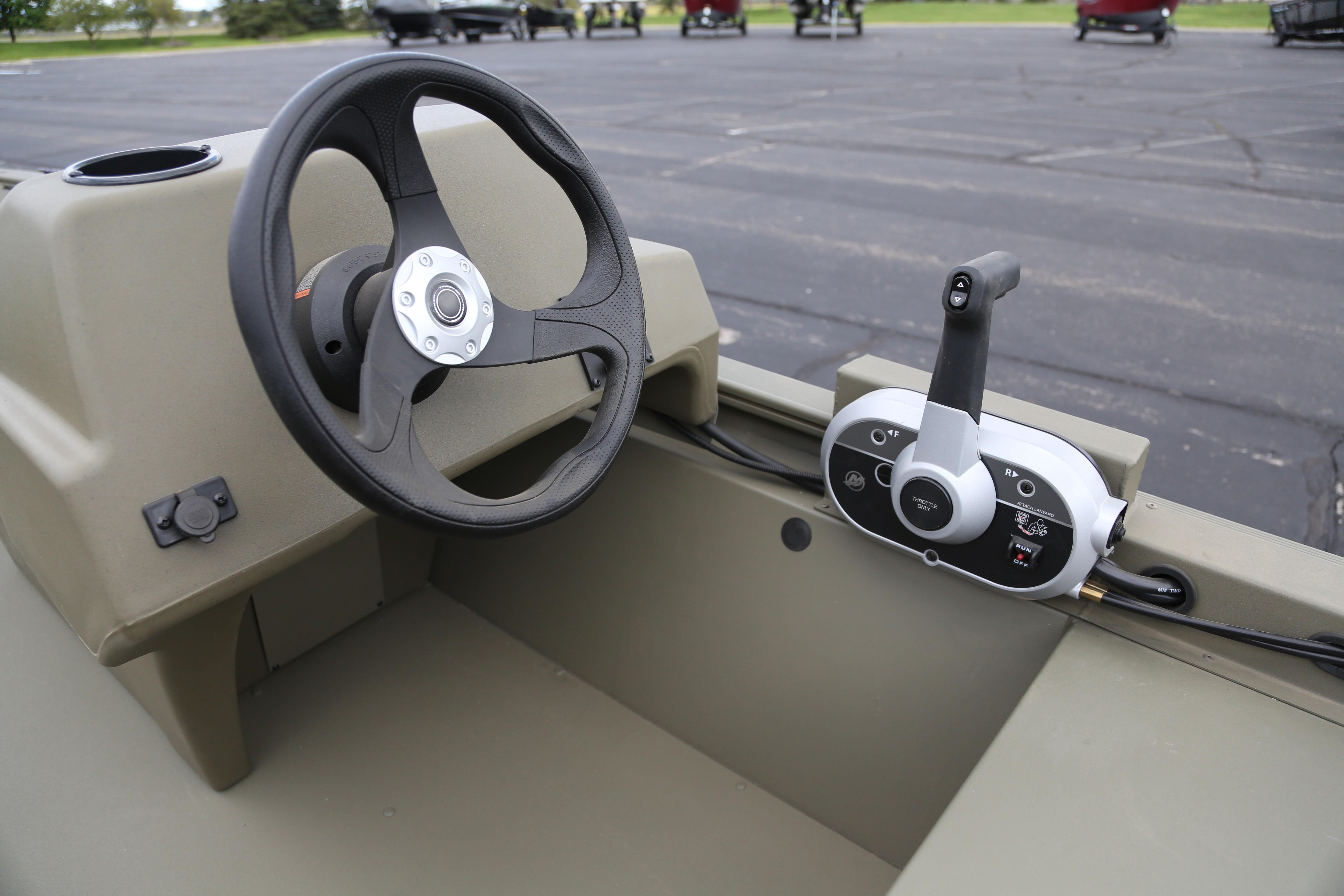 2026 Tracker Grizzly 1648 SC boat steering wheel and control panel close-up.