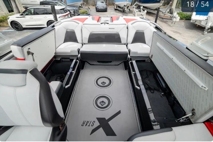 2019 MasterCraft XStar boat interior with spacious seating and storage compartments.
