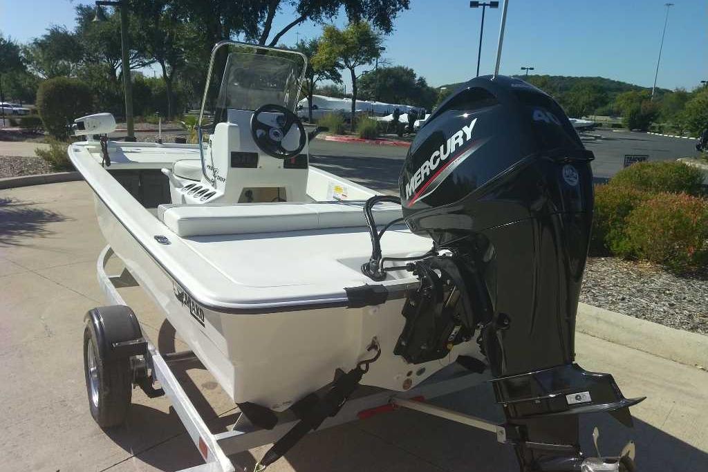 2026 Mako Pro Skiff 13 CC boat with Mercury outboard motor on trailer.