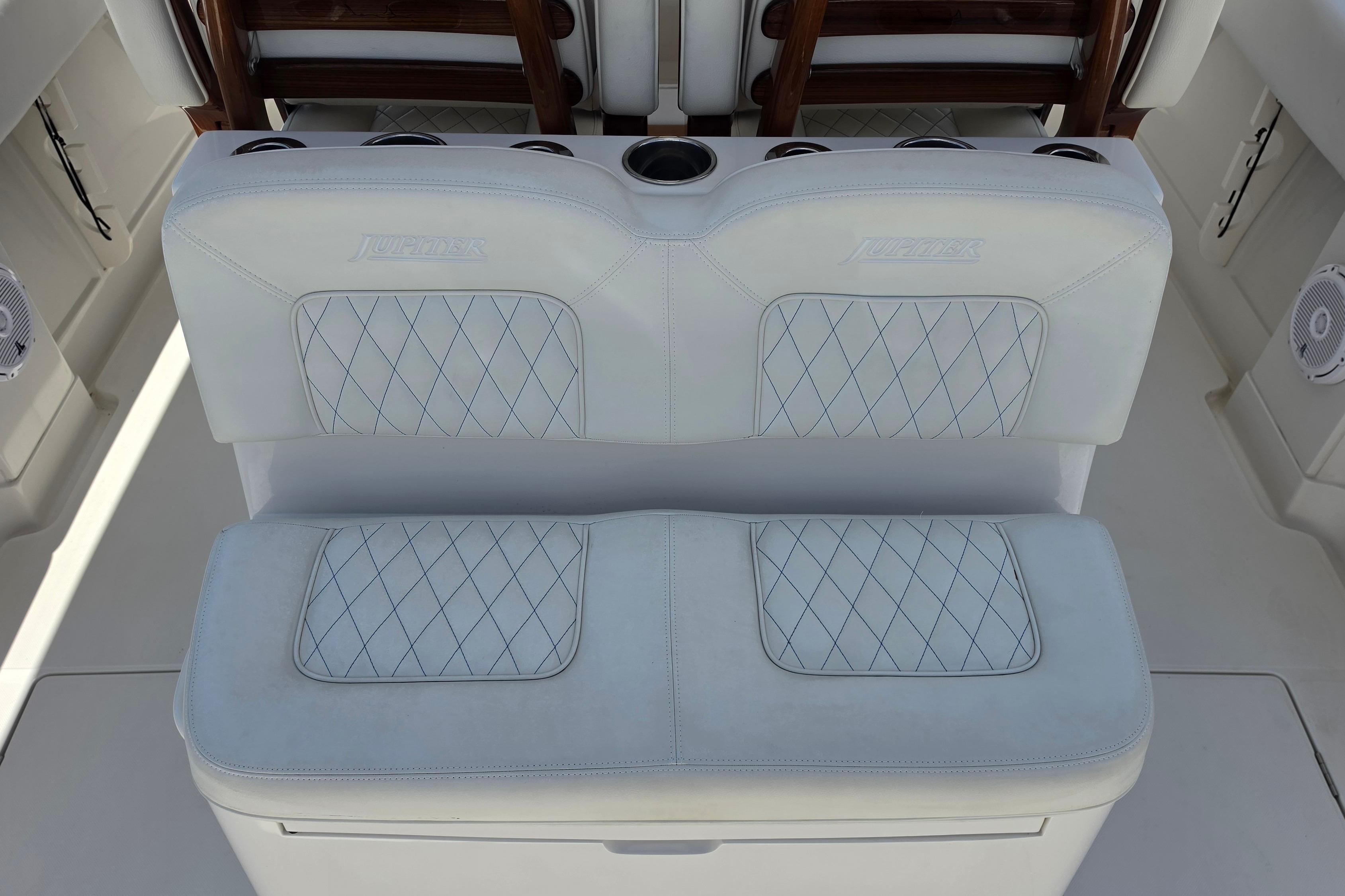 Luxury seating on a 2020 Jupiter 34 HFS boat with diamond-stitched upholstery.