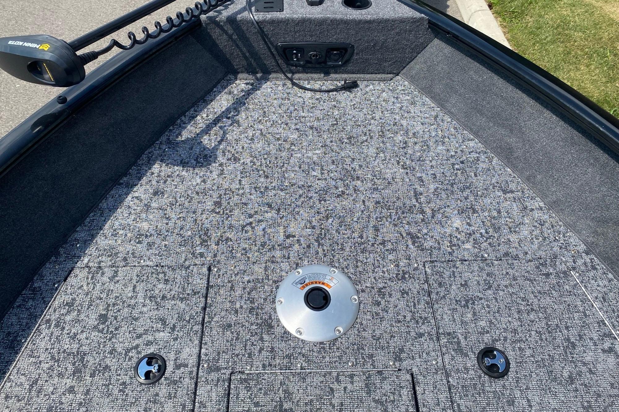 2026 Tracker Pro Guide V-175 Combo boat deck with carpeted surface and fishing seat mount.