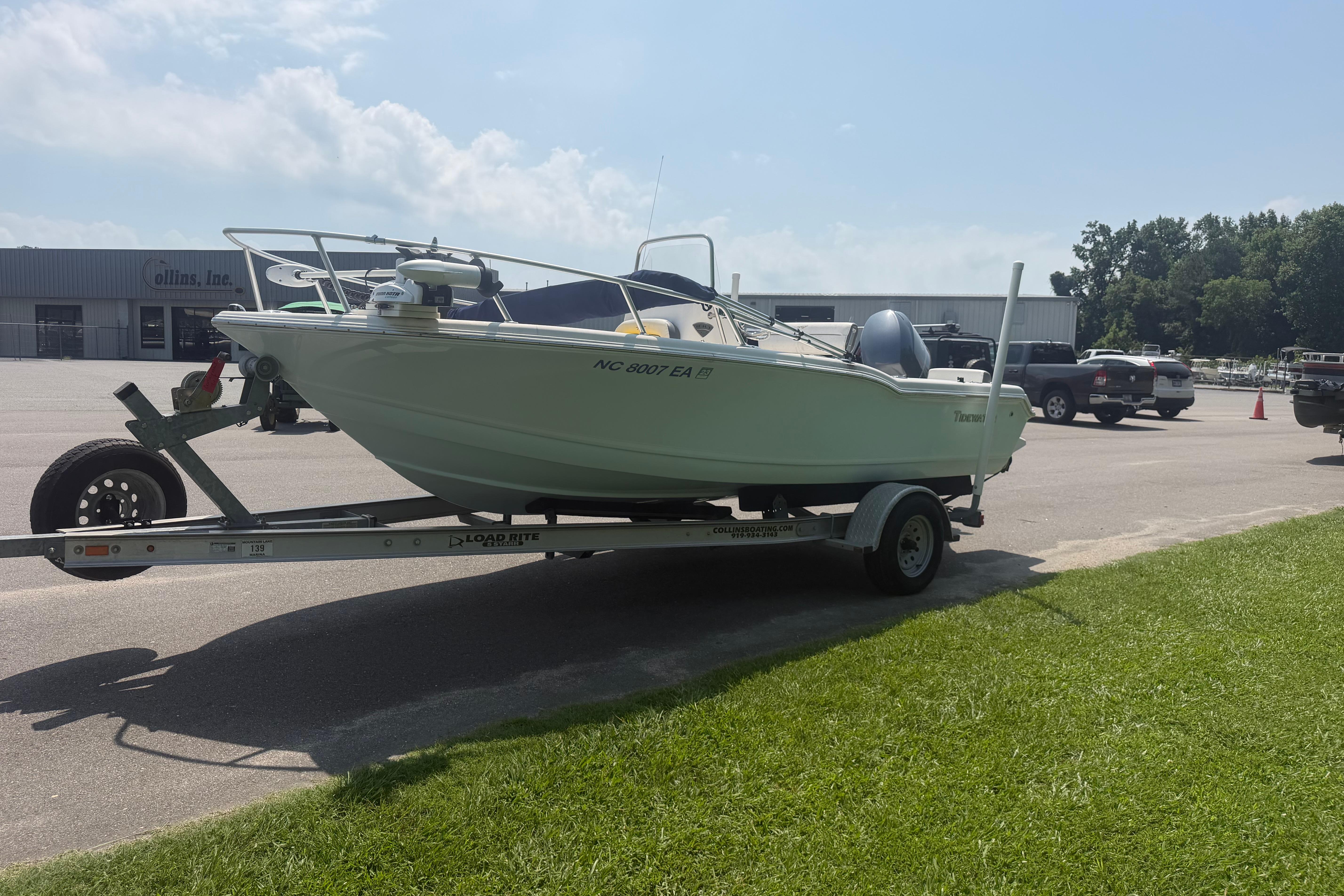 2015 Tidewater 180 CC Adventure boat on trailer in parking lot.