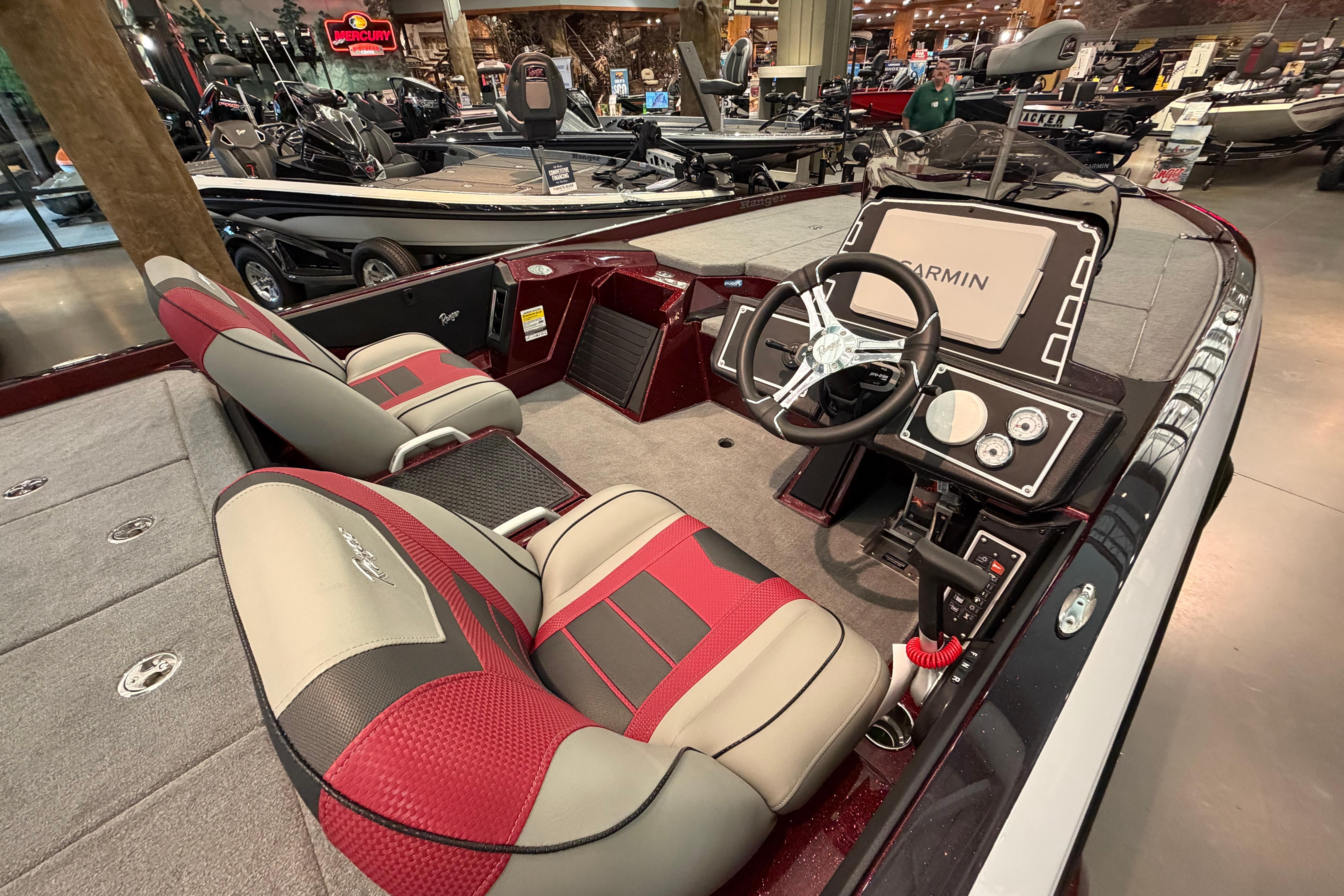 2026 Ranger Z521 boat interior with red and gray seats, Garmin navigation system.