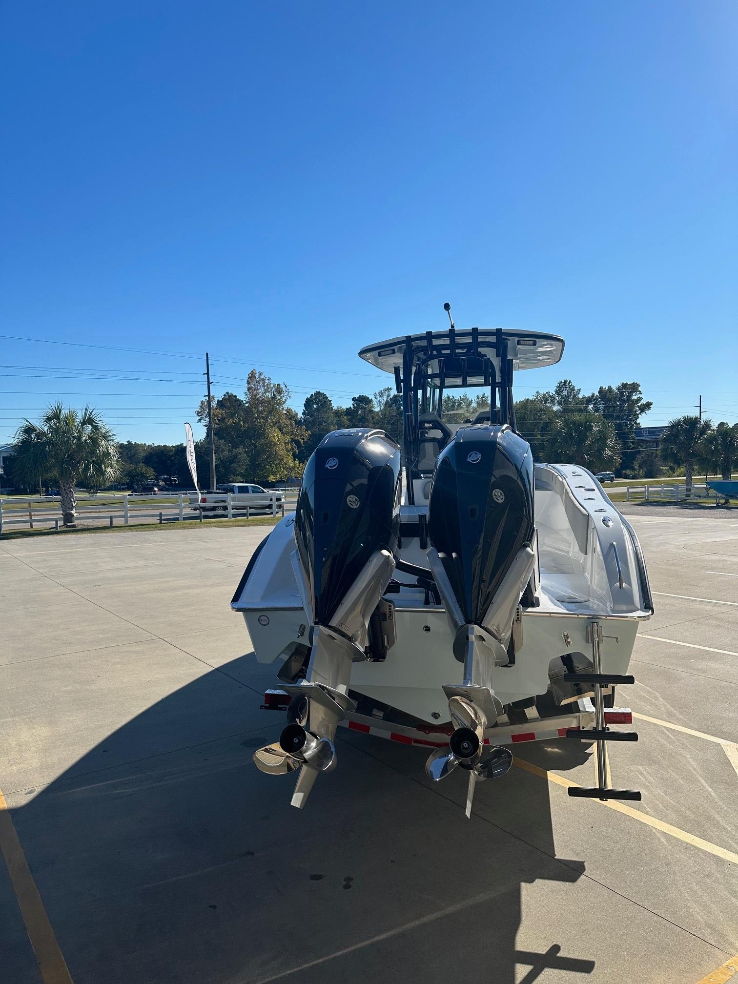 2025 Cape Horn 28XS boat with dual outboard motors in a sunny parking lot.