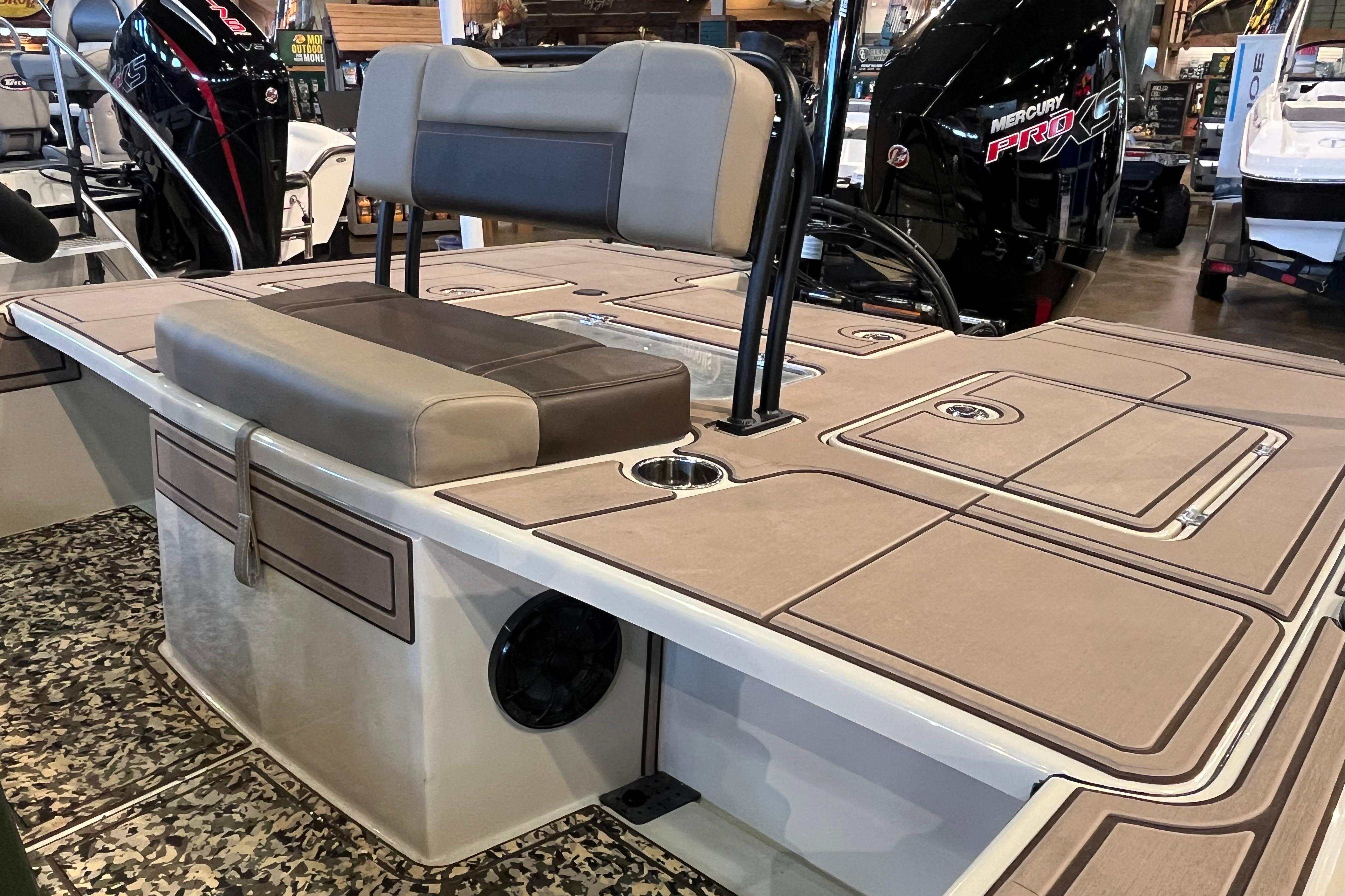 2025 Mako 18 Pro Skiff Backwater Edition boat interior with seating and storage compartments.