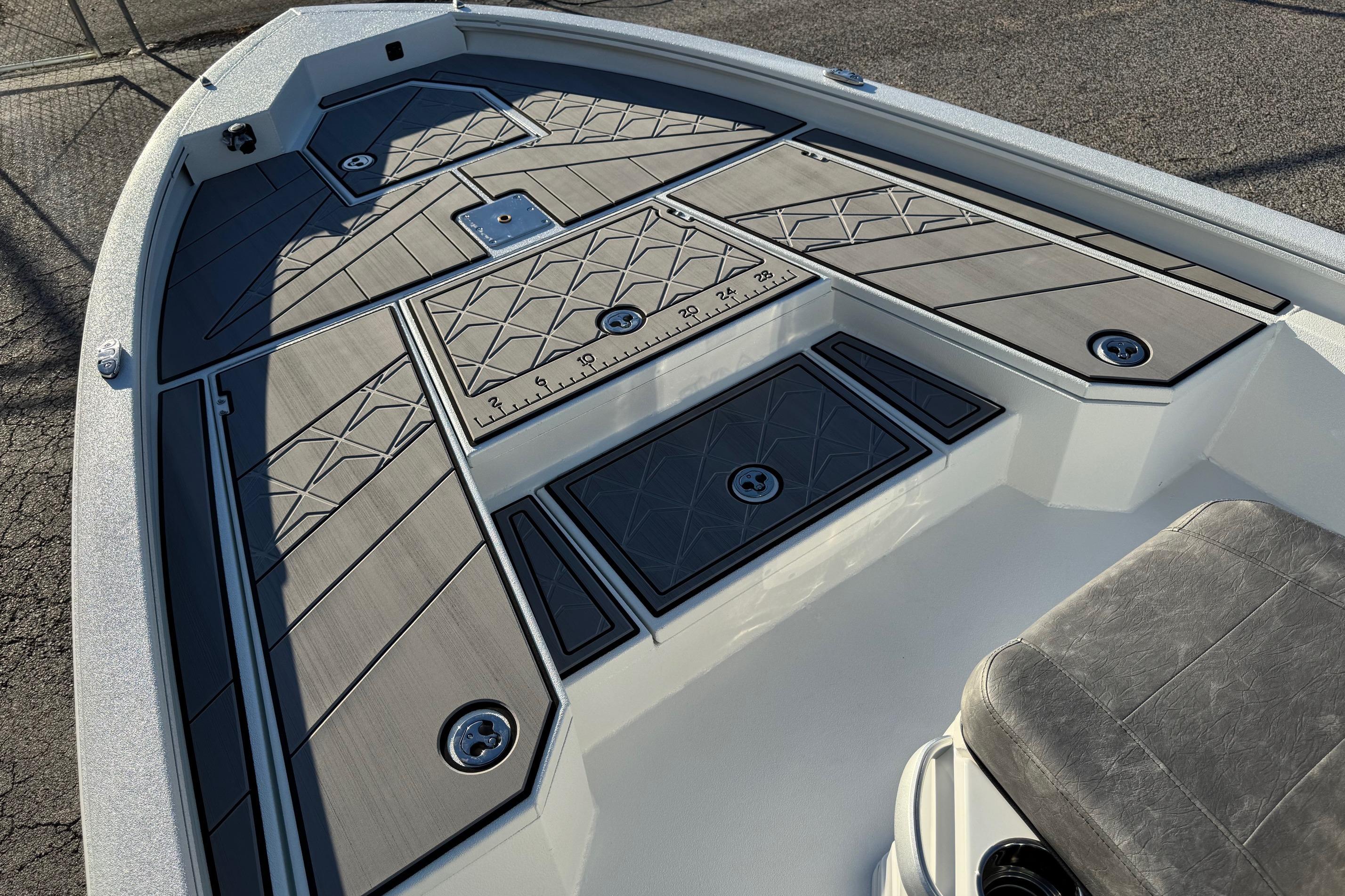 2025 Avid 23 Mag boat deck with sleek, modern design and textured flooring.