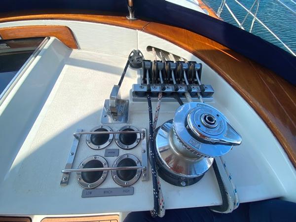 Sailing yacht Irwin 54 (1989) deck controls and winch in sunlight.