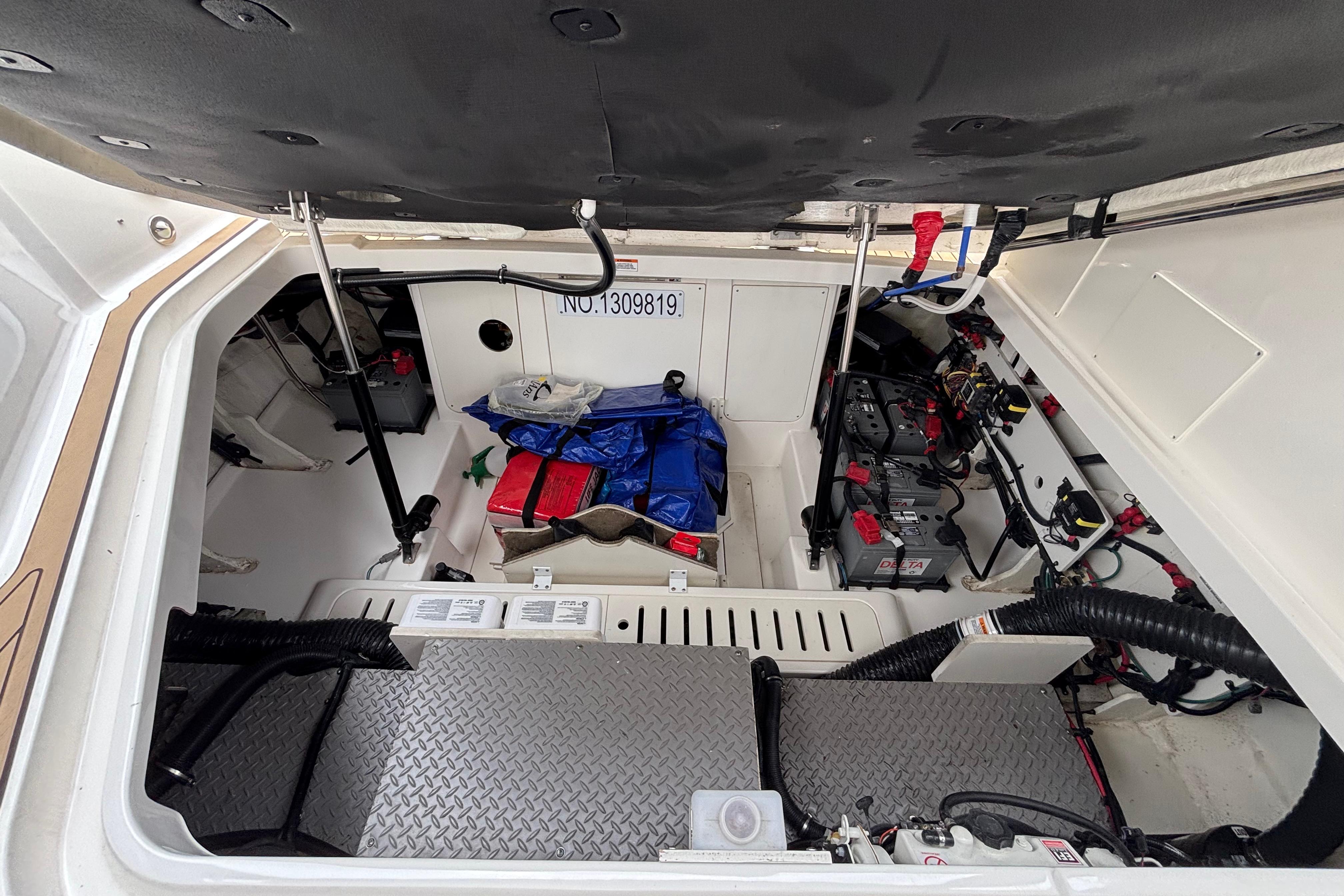 2021 Sea Ray Sundancer 320 Outboard engine compartment with batteries and equipment.