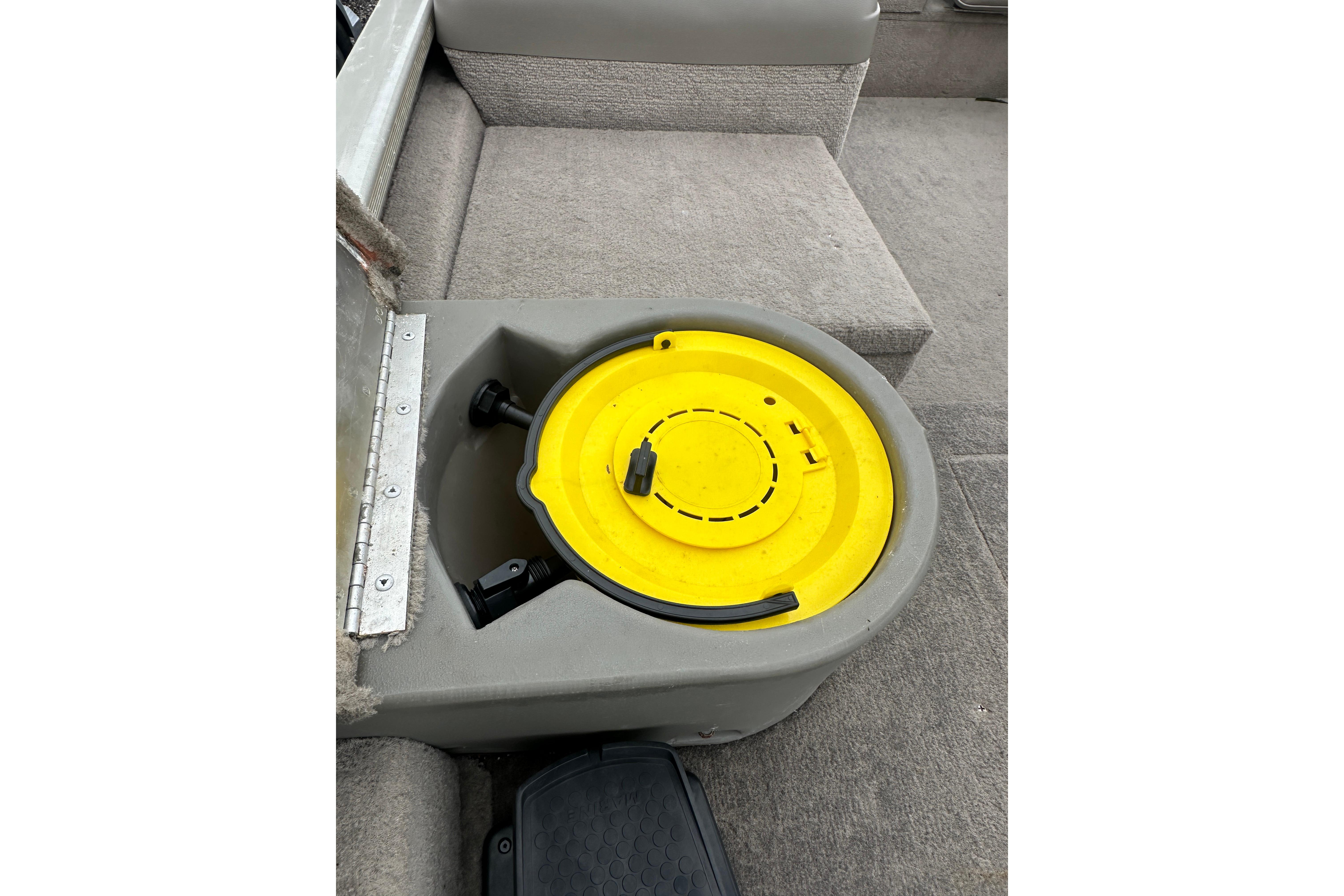 Boat interior with yellow lid compartment, Fisher 1710 model, 2002.