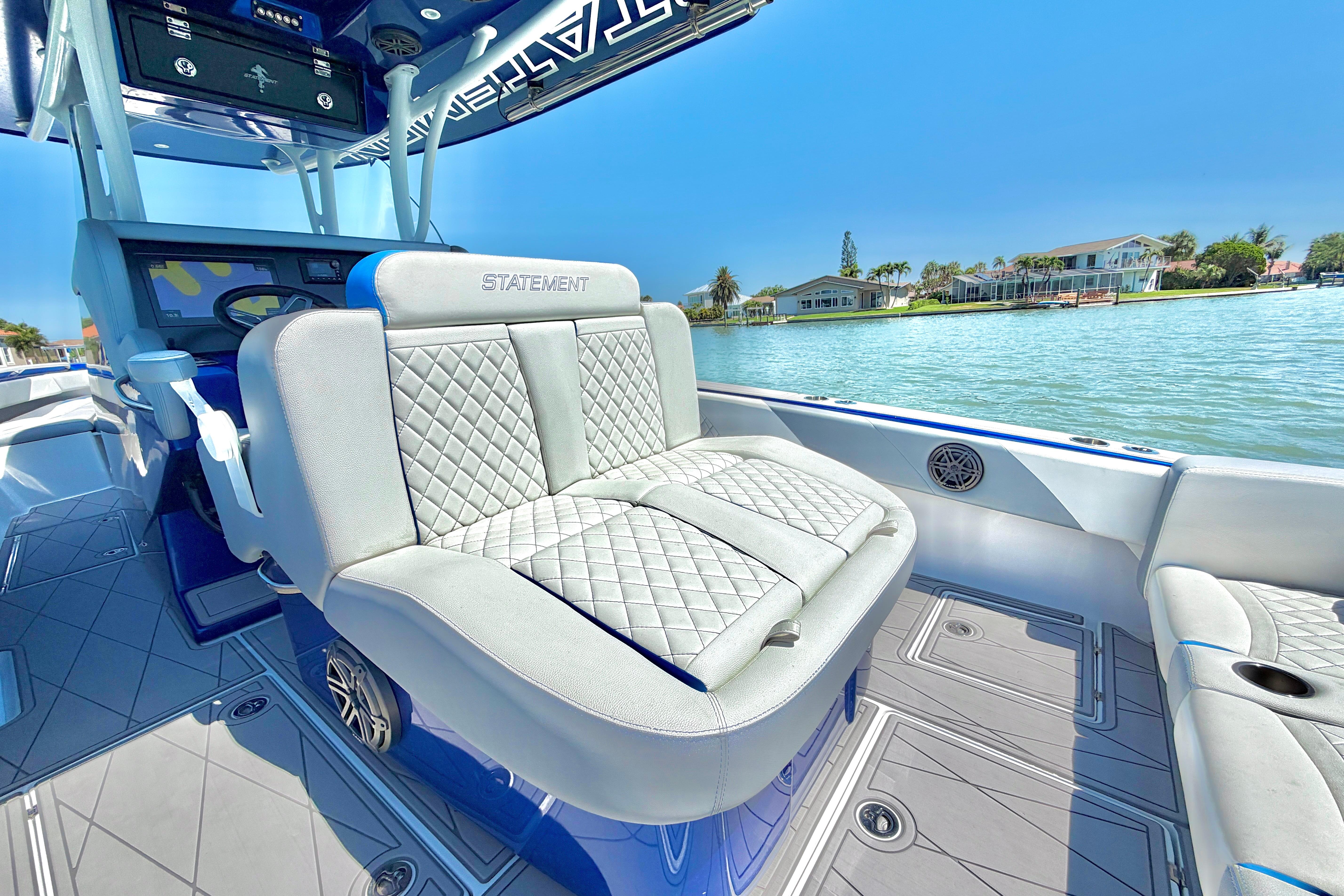 Luxury seating on 2022 Statement 350 Open boat, with waterfront view.