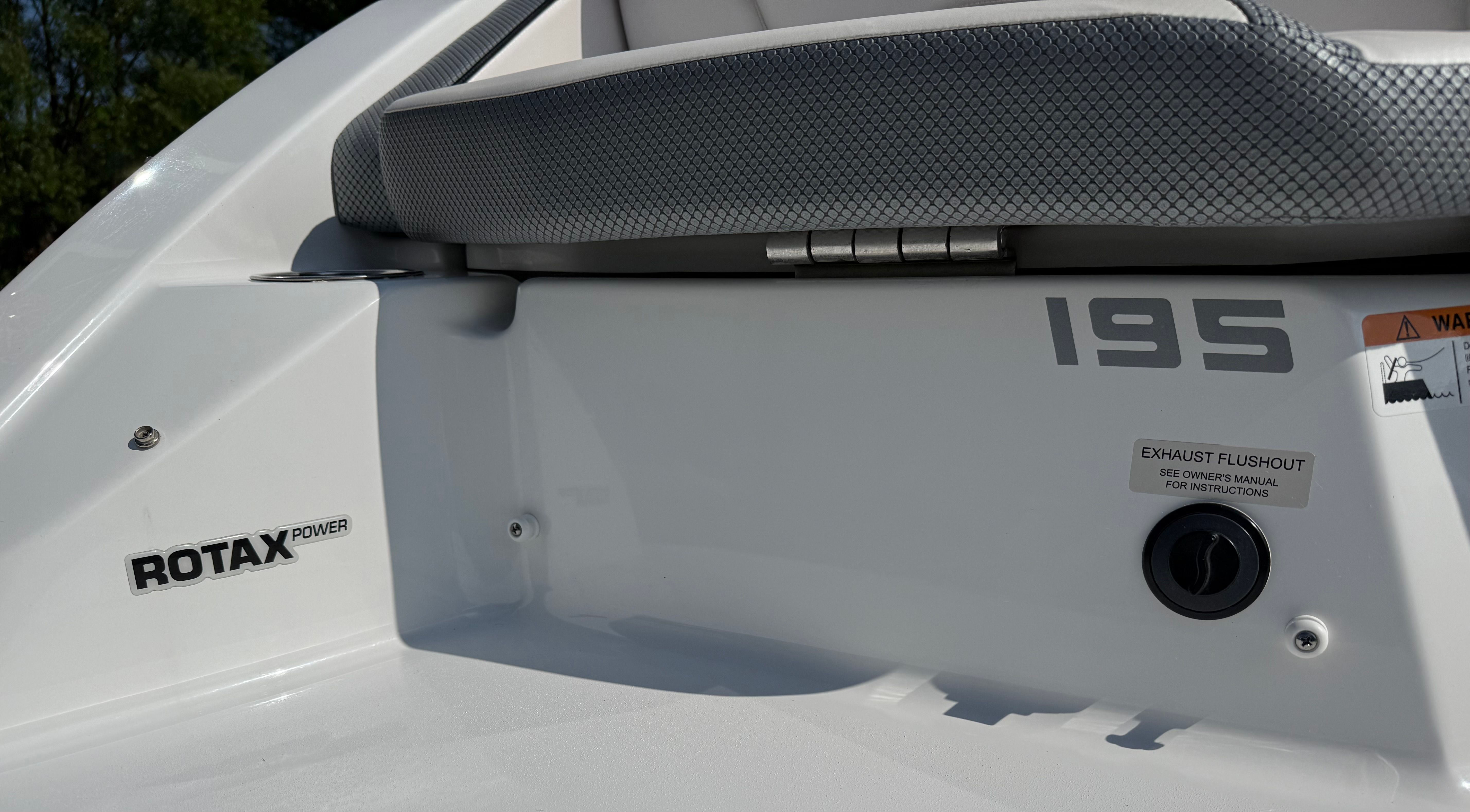 Close-up of the stern of a Scarab 195 ID boat with Rotax Power logo.