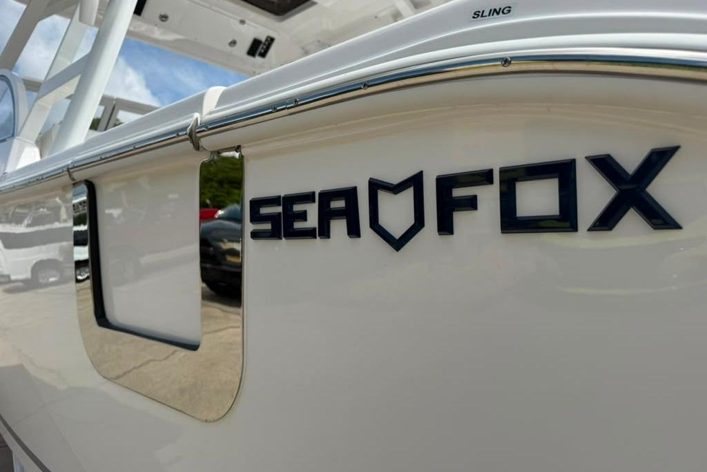 2026 Sea Fox 288 Traveler boat, close-up of logo on white hull.