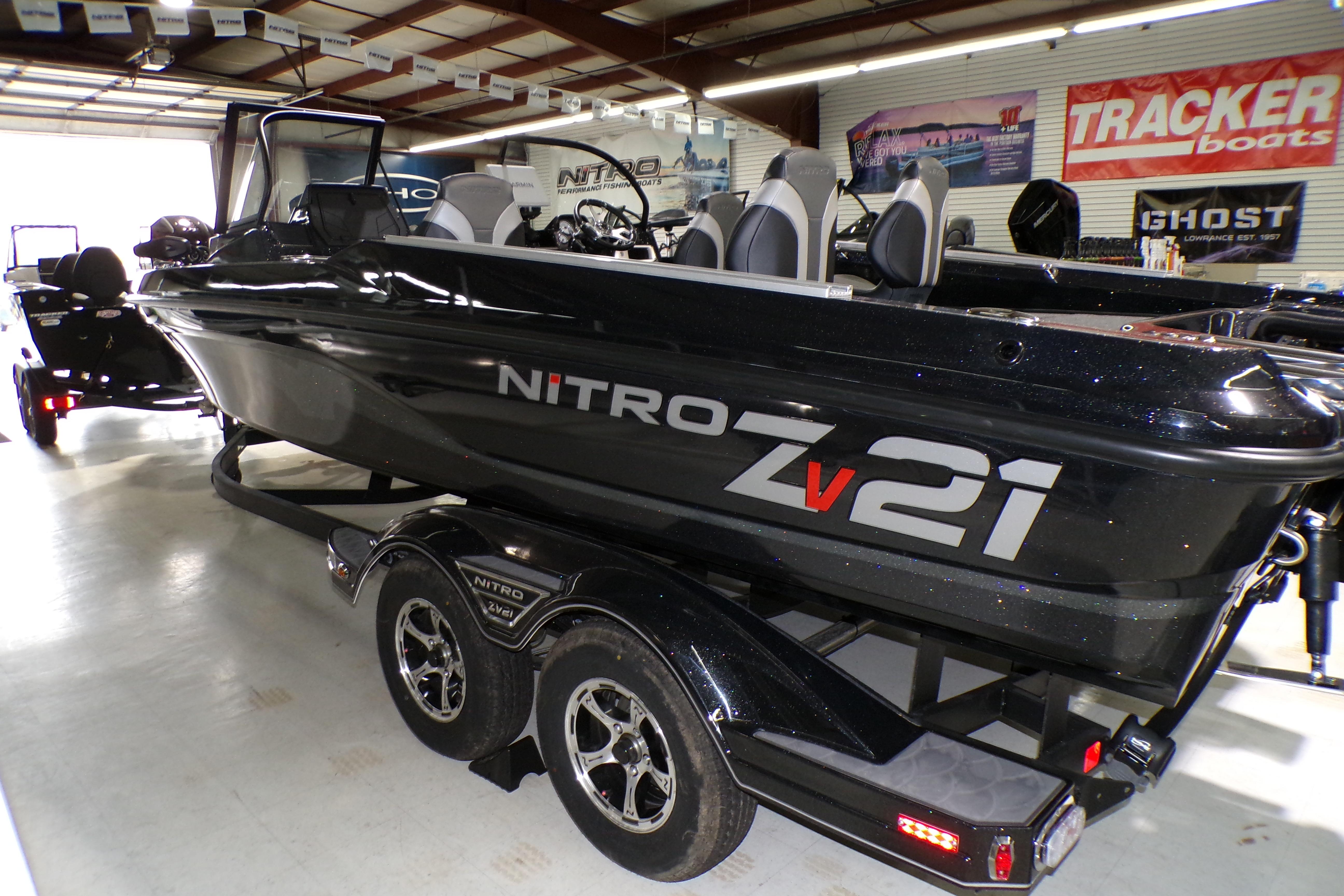 2026 Nitro ZV21 Pro boat in showroom, sleek black design on trailer.