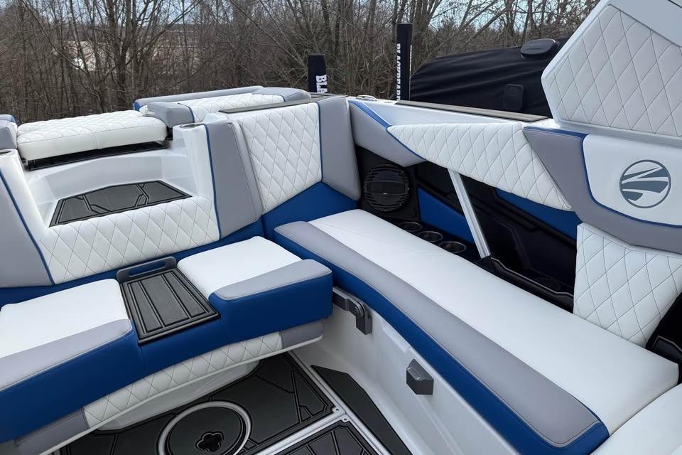 2026 Tigé Z3 boat interior with luxurious white and blue seating, quilted design.