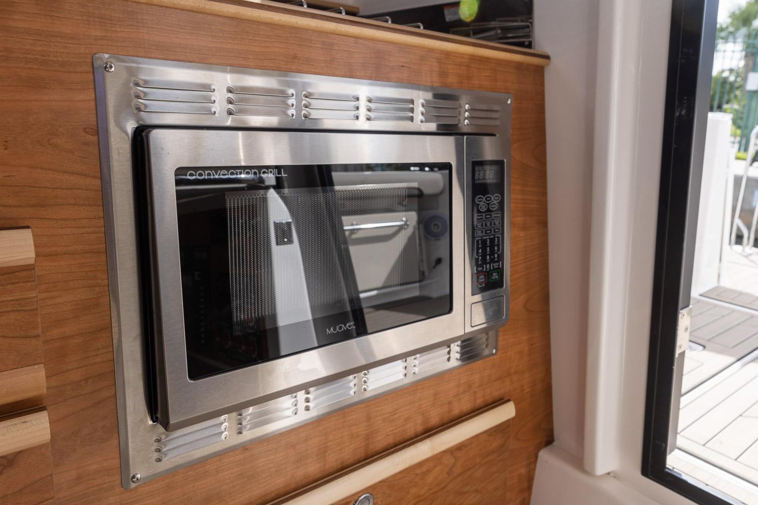 Built-in microwave in 2025 Cutwater C-288 Coupe LE boat interior.