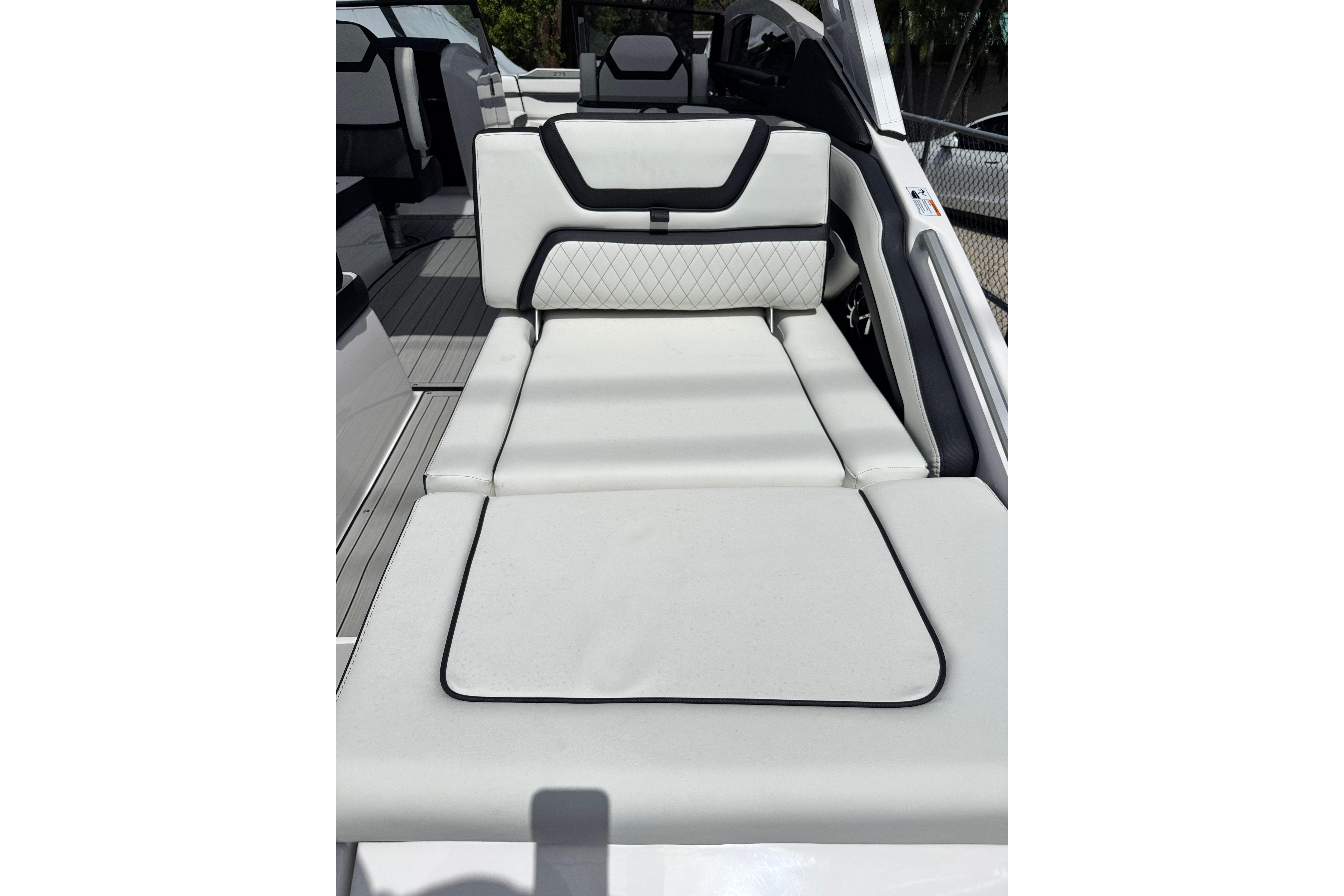 2026 Yamaha Boats 275SD interior with luxurious white seating and modern design.