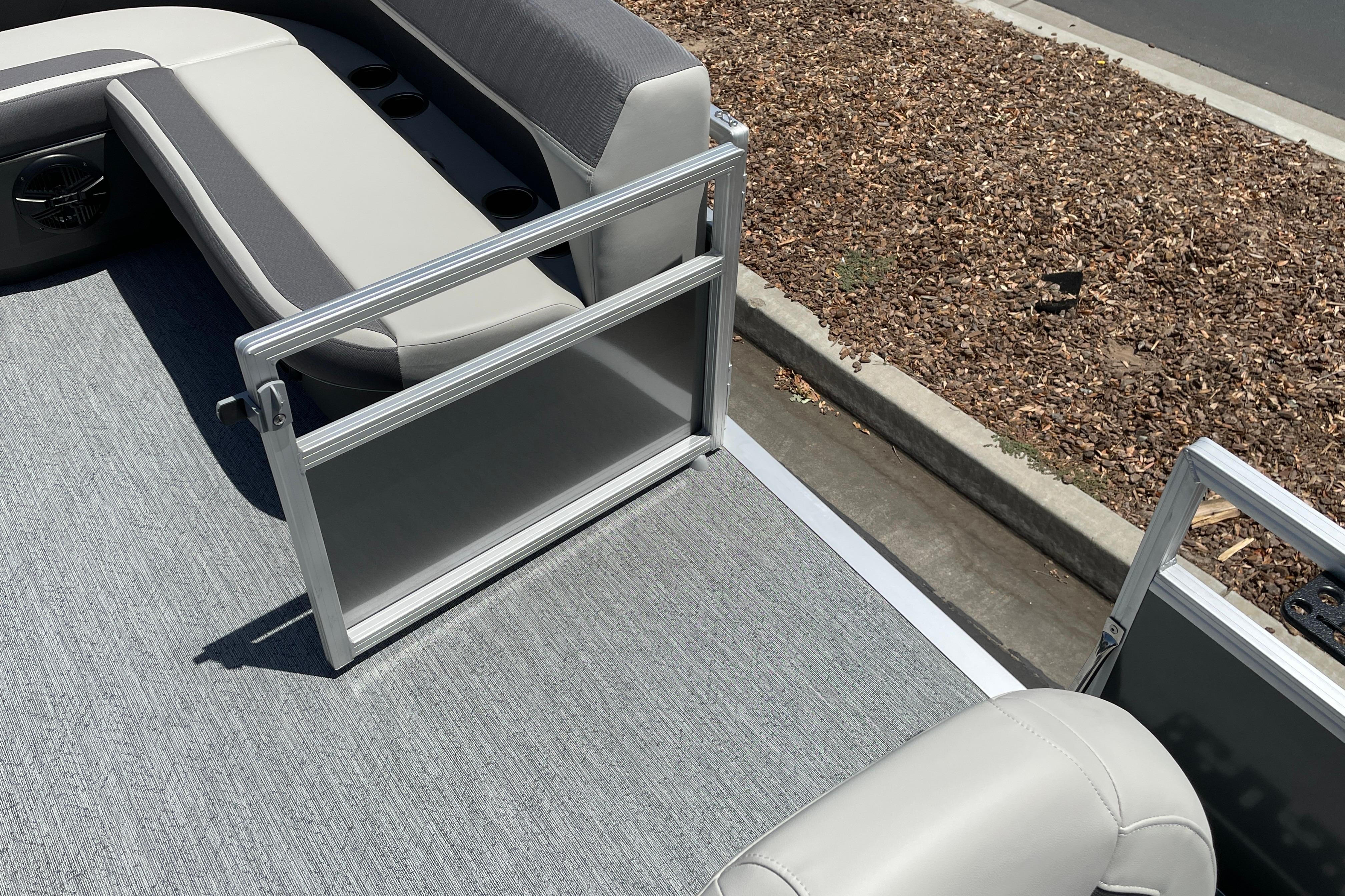 2026 Sun Tracker Bass Buggy 16 XL Select pontoon boat interior with seating and open gate.