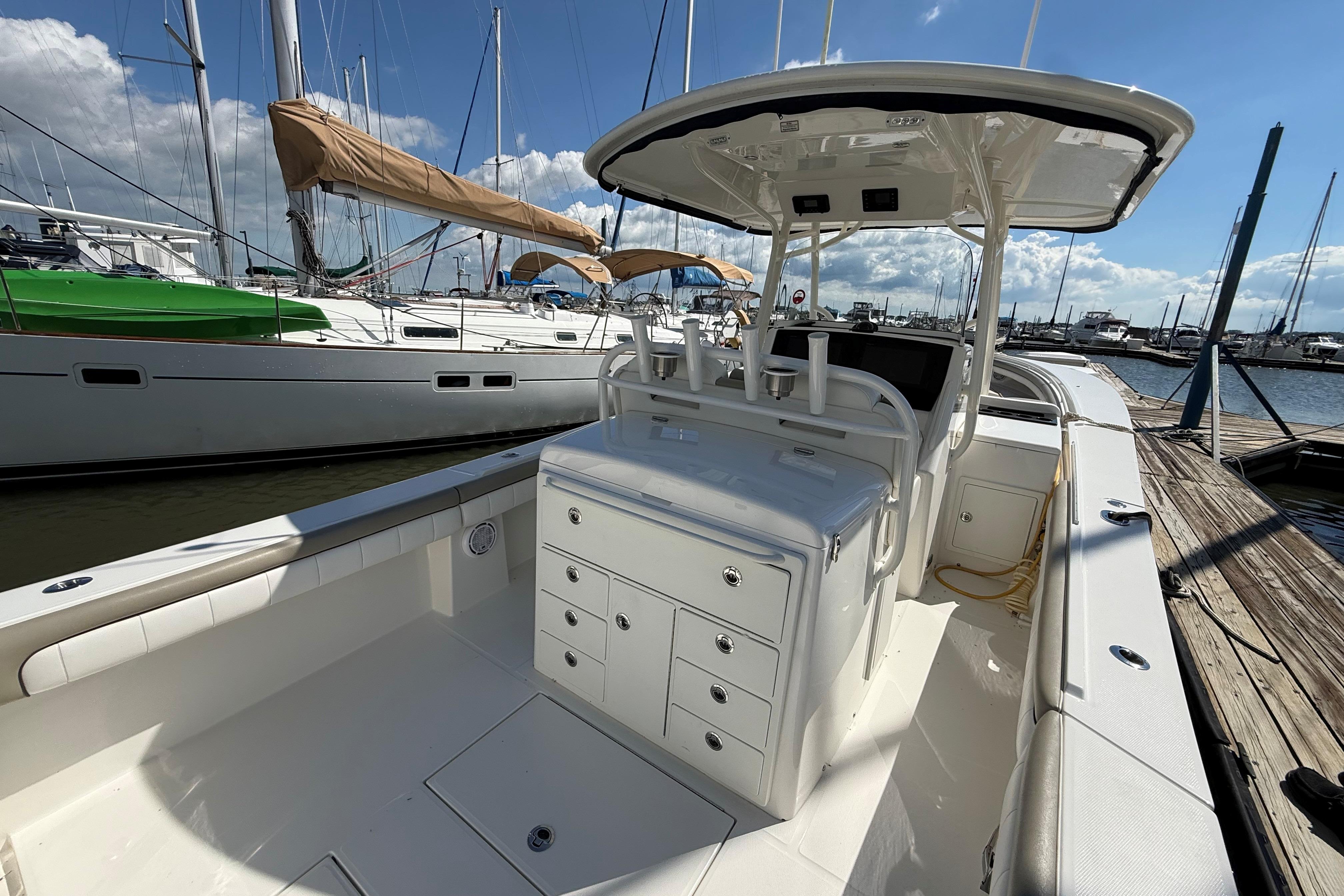 2019 Regulator 34SS boat docked at marina, featuring spacious deck and storage compartments.