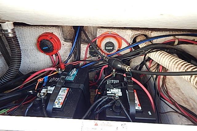Electrical system of a 2003 World Cat 270 EC boat with batteries and wiring.