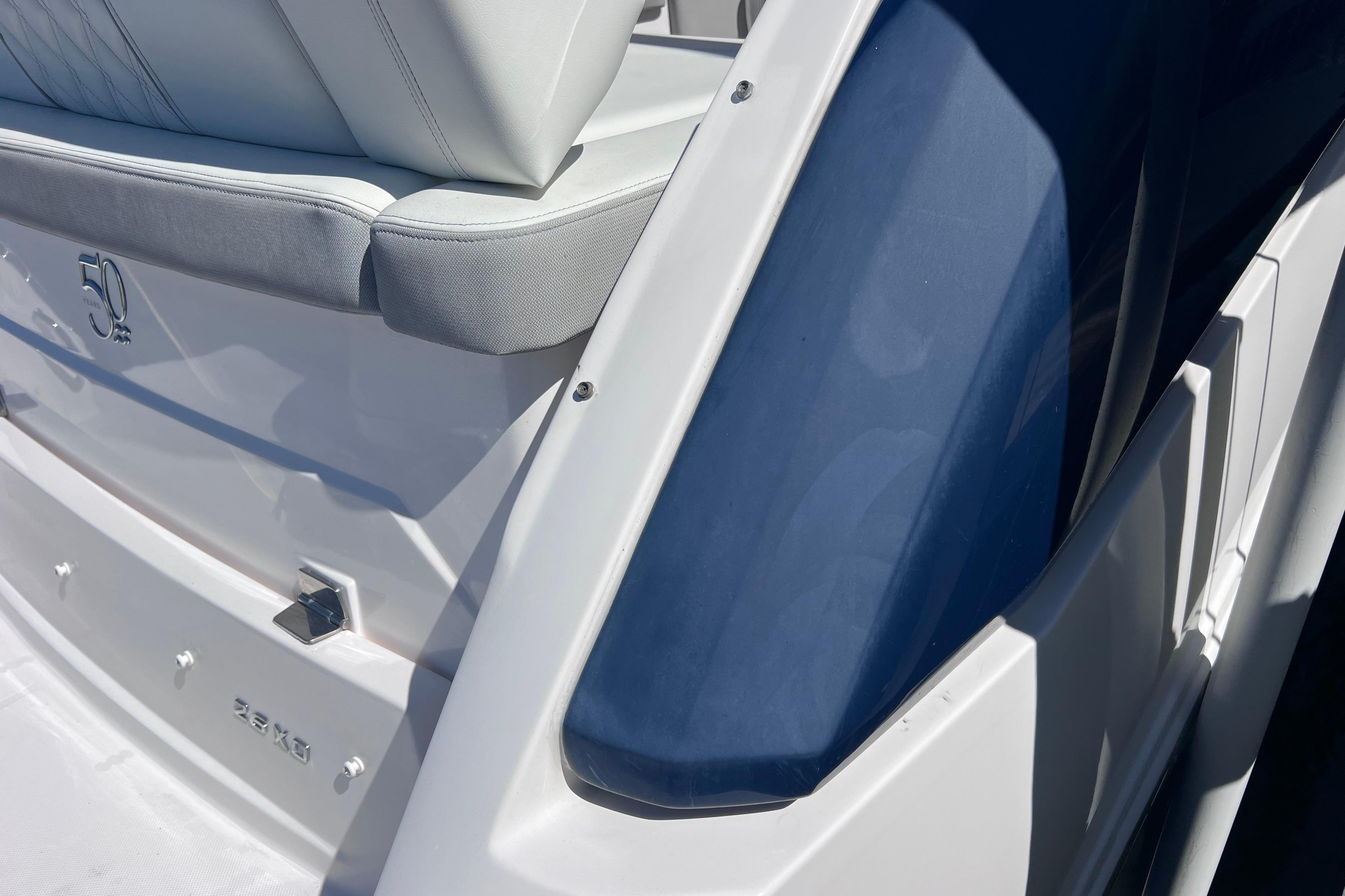 2020 Regal 26 XO boat, featuring sleek white and blue design with comfortable seating.