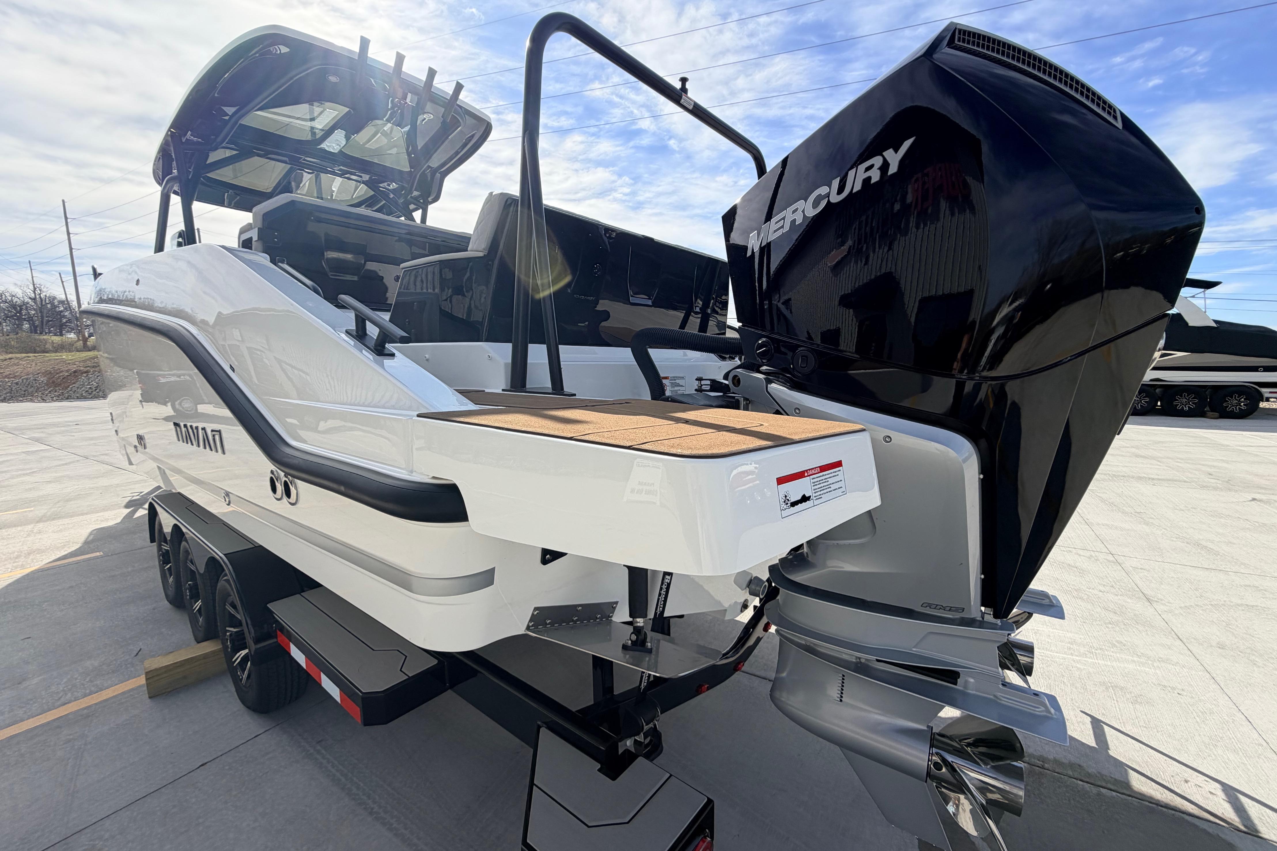 2026 Navan S30 boat with Mercury engine on trailer, outdoor display.