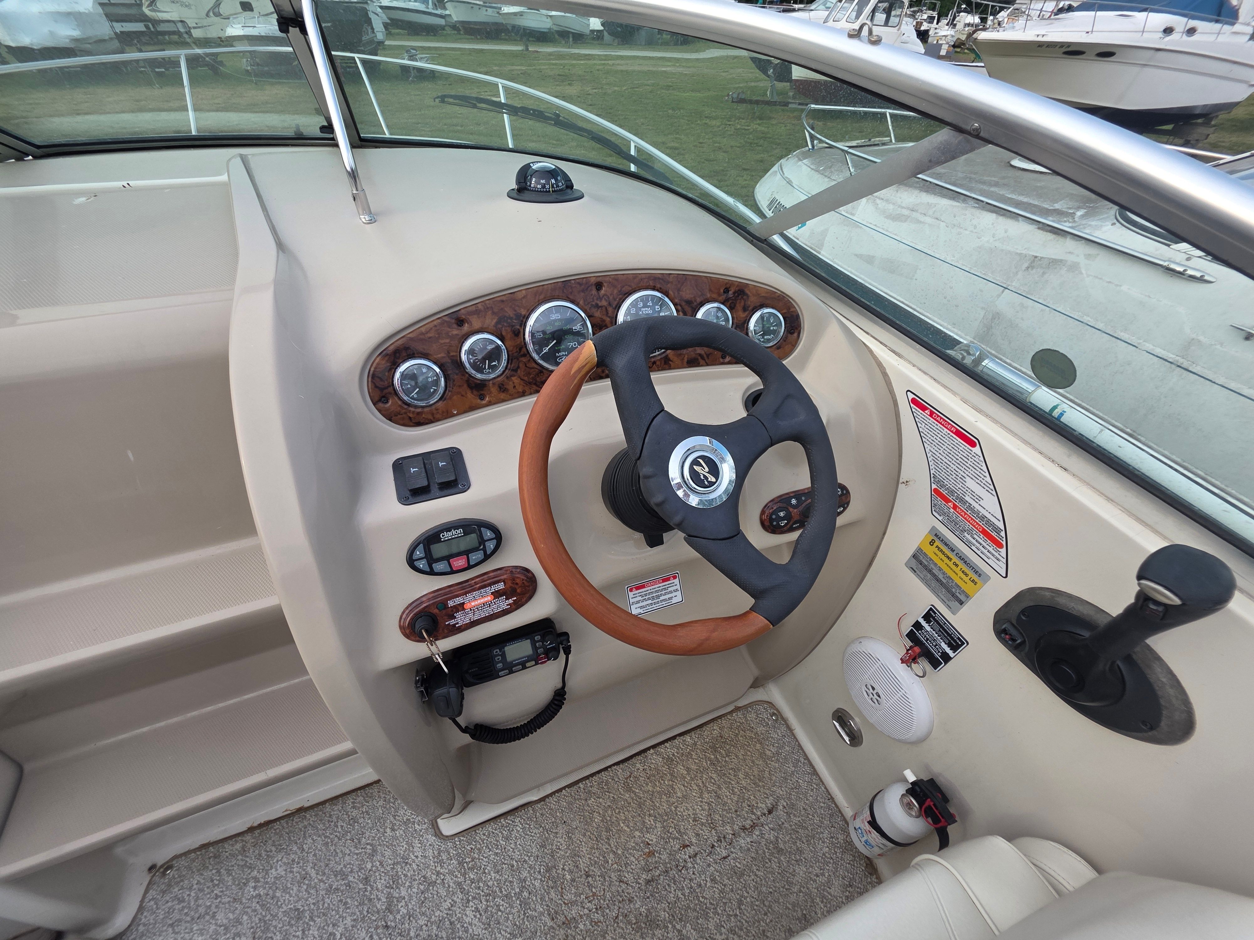 Steering console of a 2004 Sea Ray 225 Weekender boat.