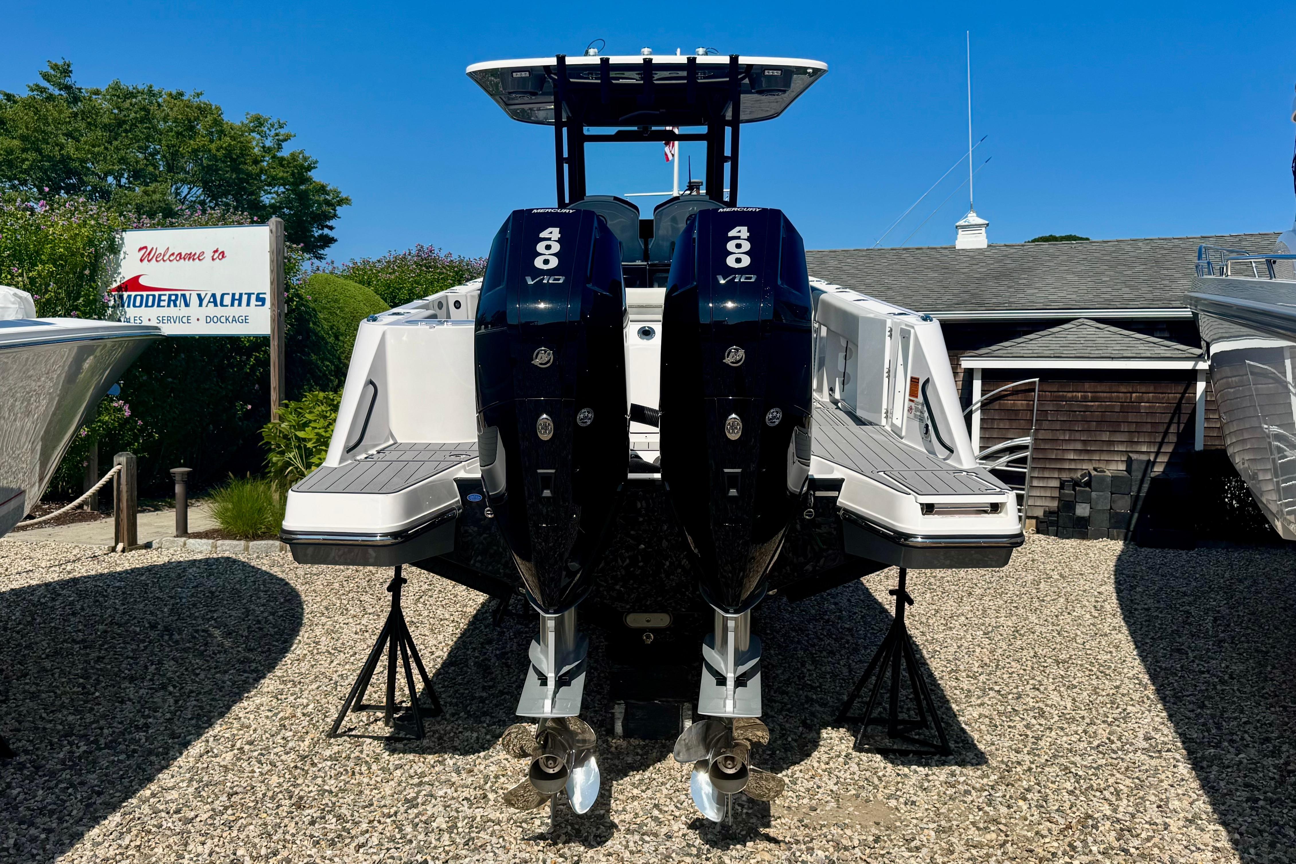 2025 Edgewater 340CC boat with twin 400 V10 engines at Modern Yachts dealership.