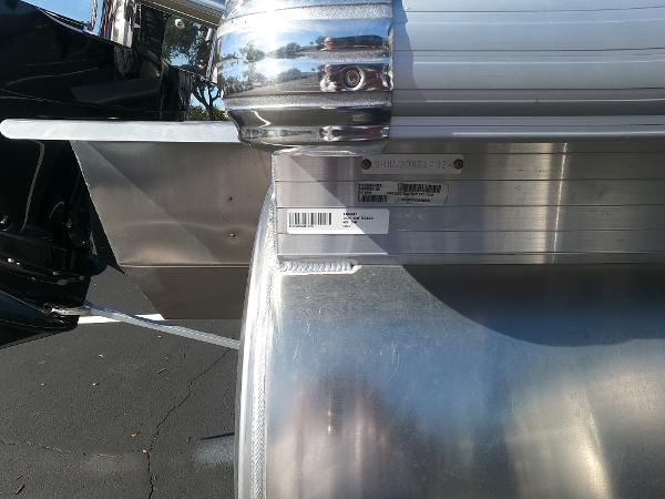 Close-up of 2024 Sun Tracker Fishin' Barge 22 XP3 pontoon boat's identification plate.