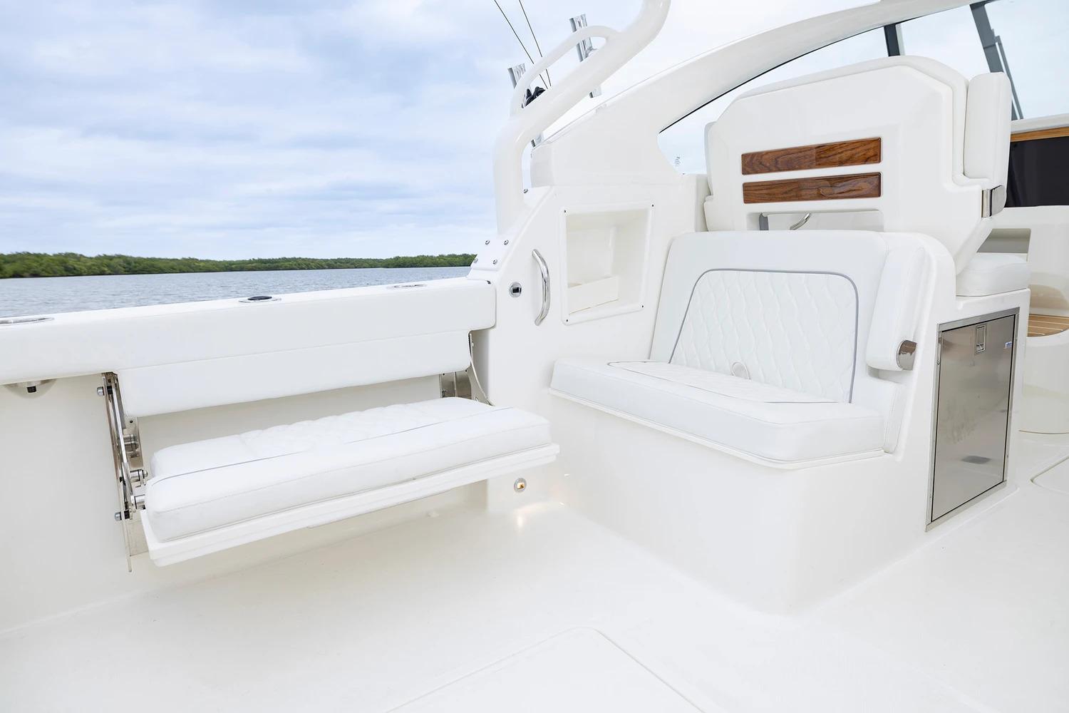 Manufacturer Provided Image: 2026 Pursuit DC 286 Dual Console boat interior with white seating and storage.