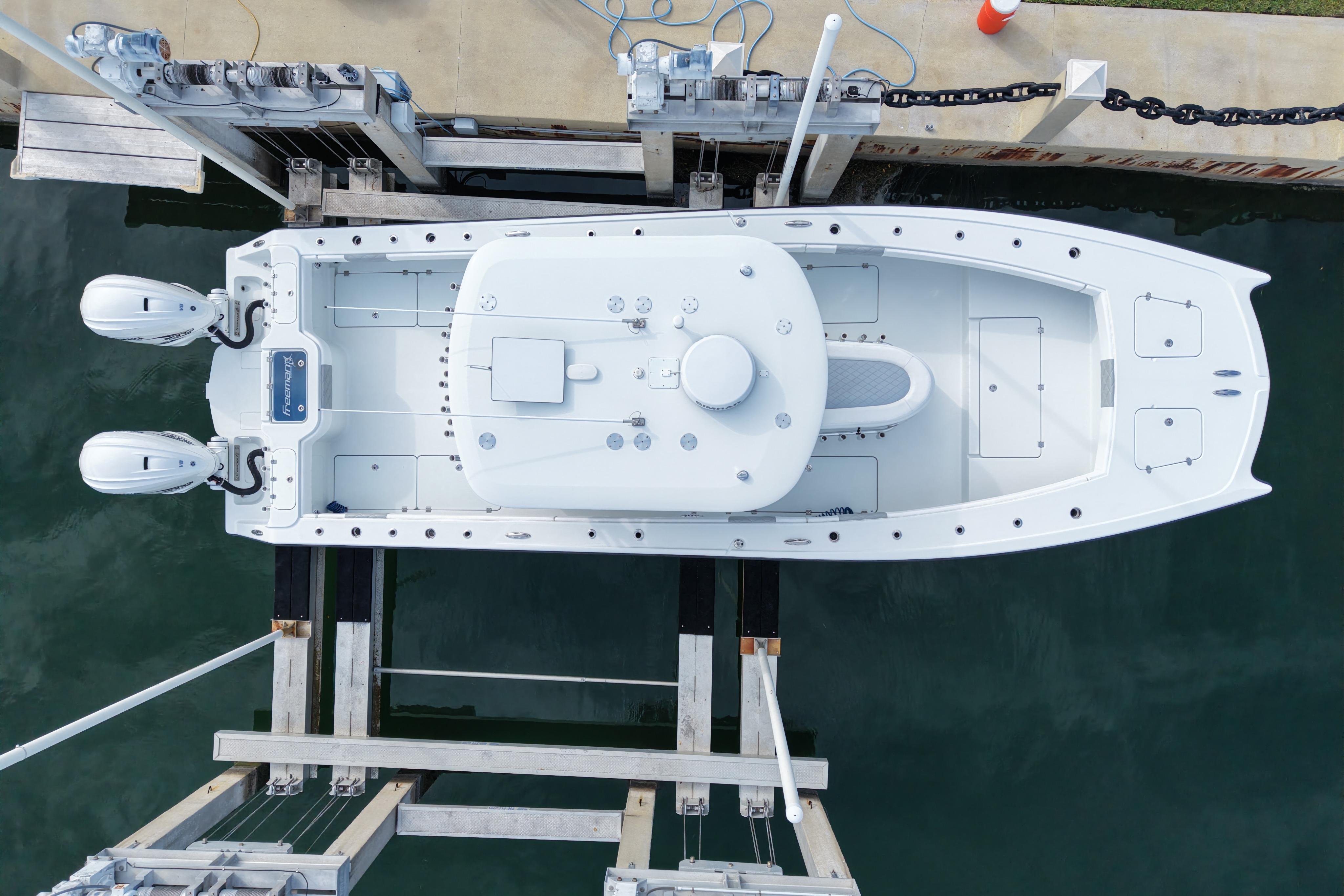 Aerial view of a 2022 Freeman 34VH boat docked with dual engines.