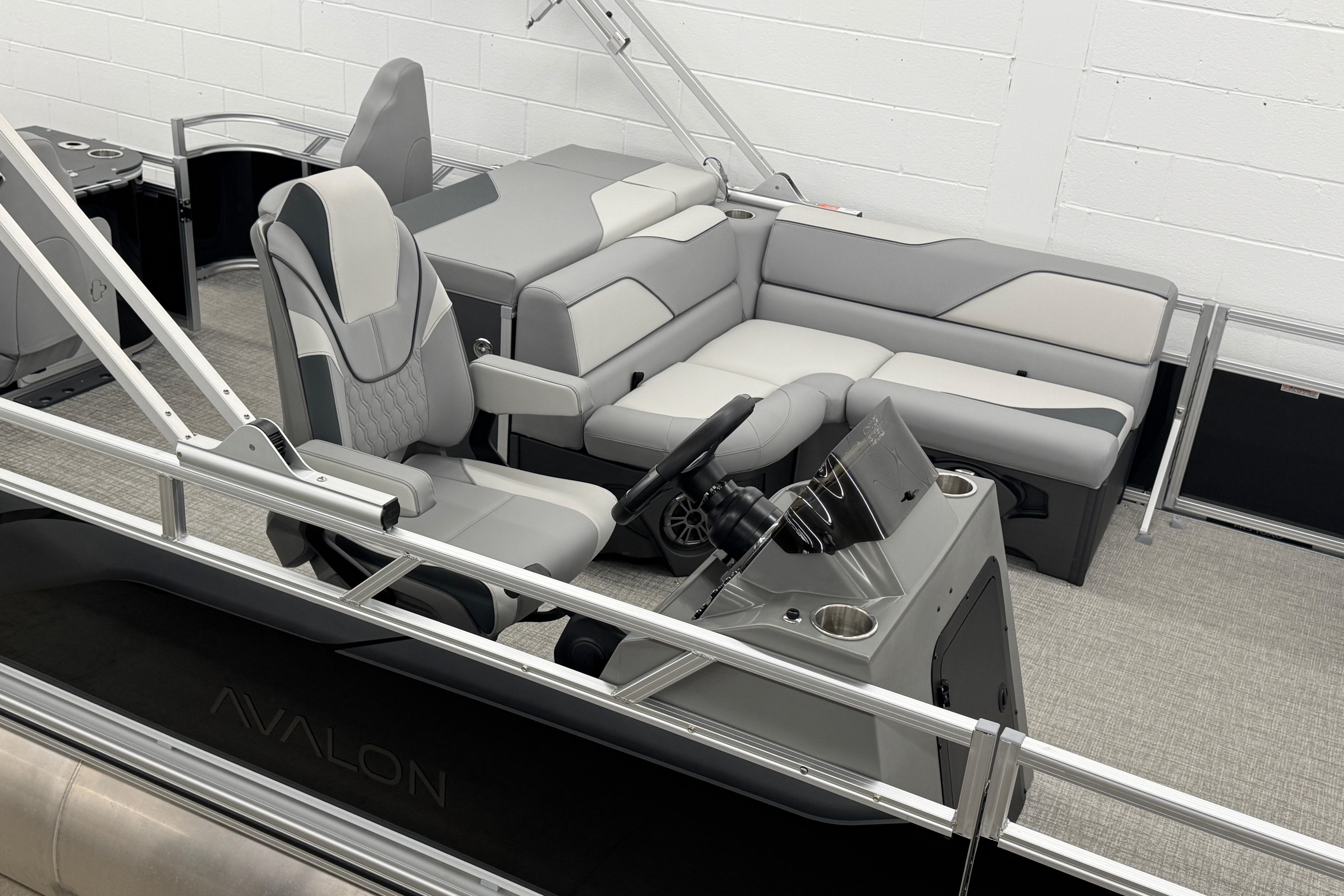 Interior of 2026 Avalon Ventue 85 RF pontoon boat with modern seating and helm.