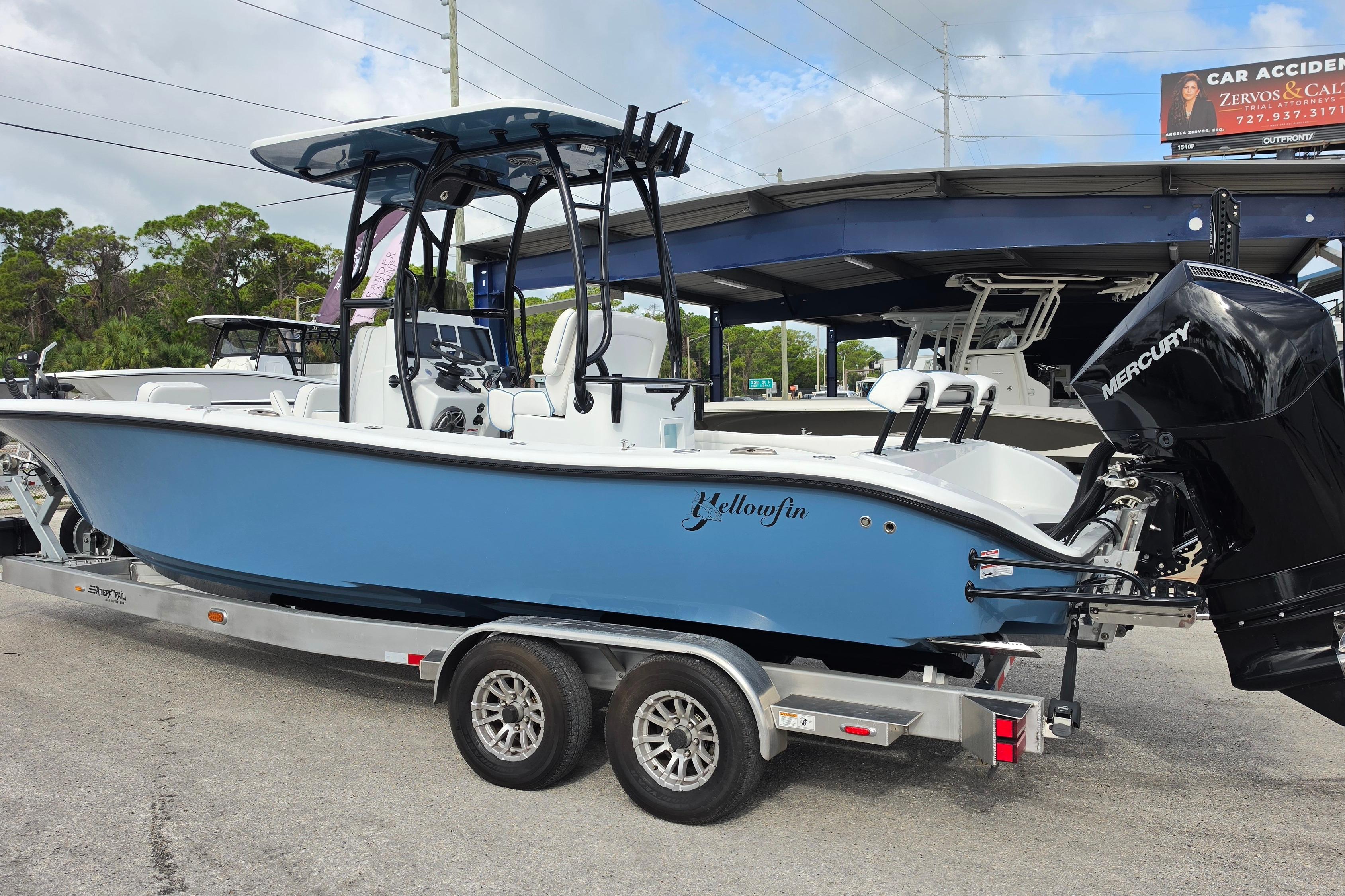 2025 Yellowfin 26 Hybrid boat on trailer, featuring sleek design and powerful Mercury engine.