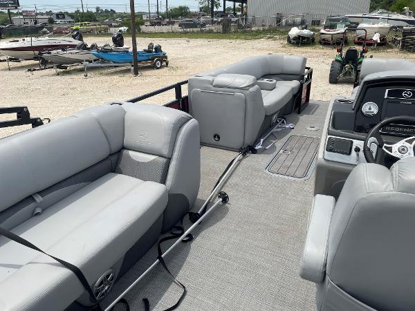 2023 Regency 250DL3 pontoon boat with spacious seating and modern interior design.