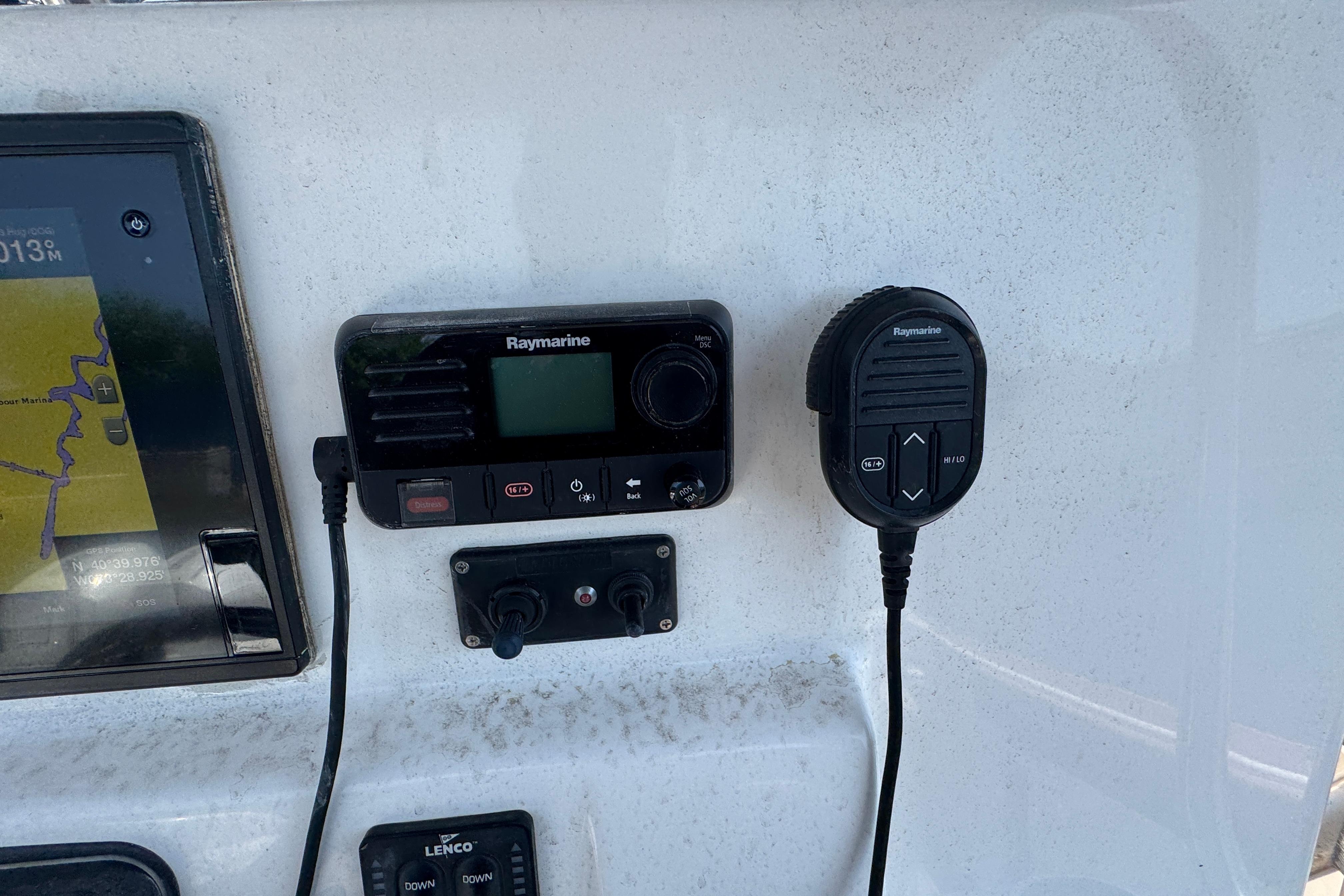 Raymarine marine radio and GPS on 2014 Century 2301 Center Console boat dashboard.