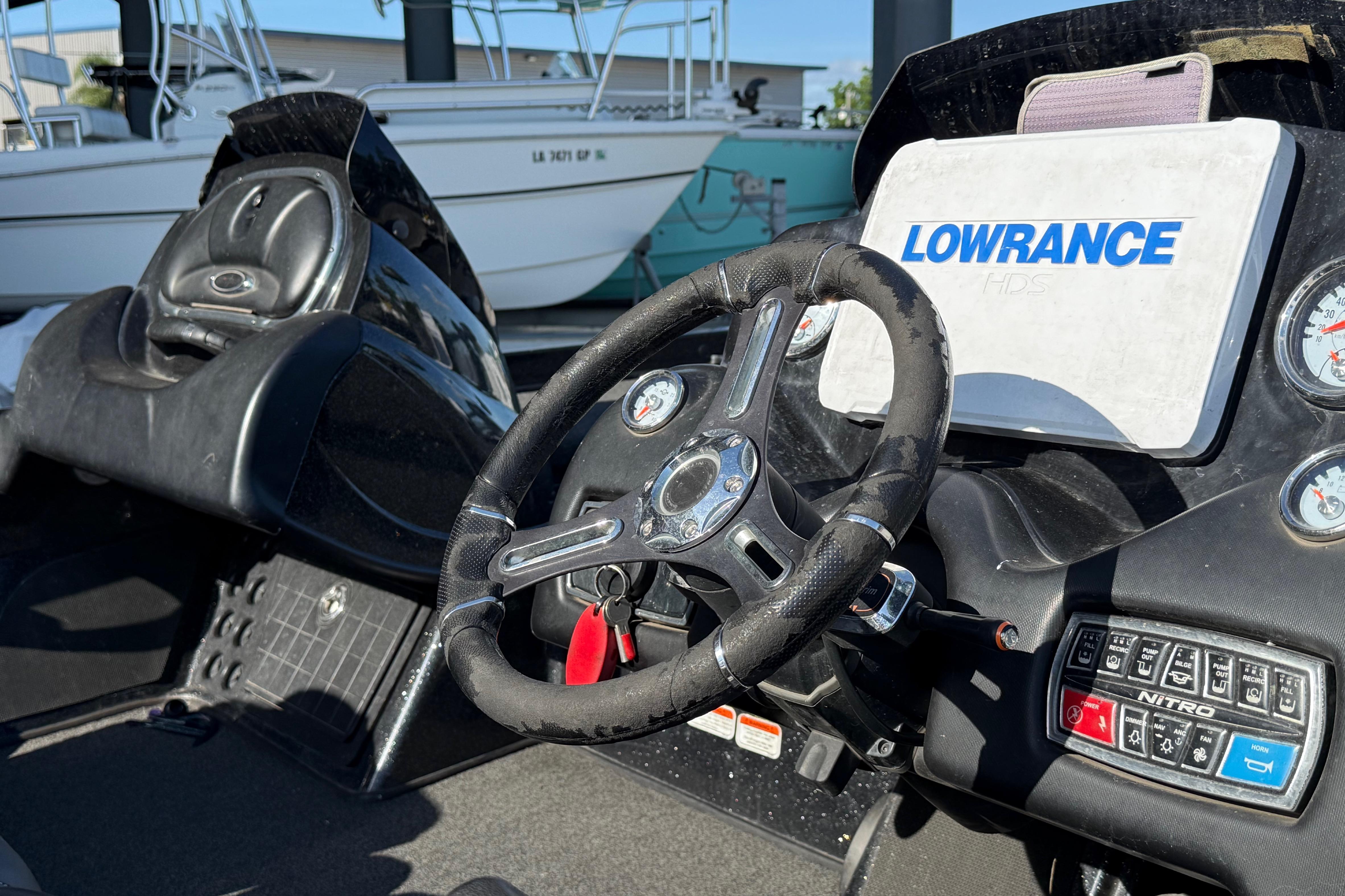 Cockpit of a 2018 Nitro Z21 boat with Lowrance HDS system and steering wheel.